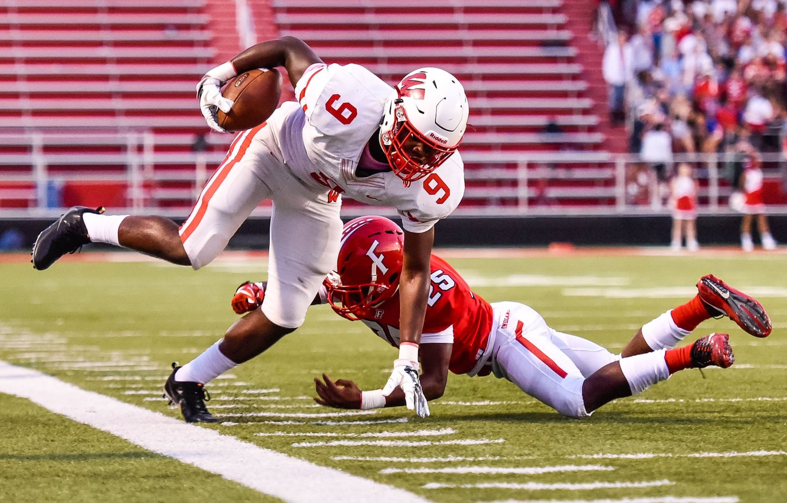 Lakota West’s Deontai Christon gets knocked out of bounds by Fairfield’s Corey Smith during their game Sept. 14 at Fairfield Stadium. Fairfield won 37-3. NICK GRAHAM/STAFF