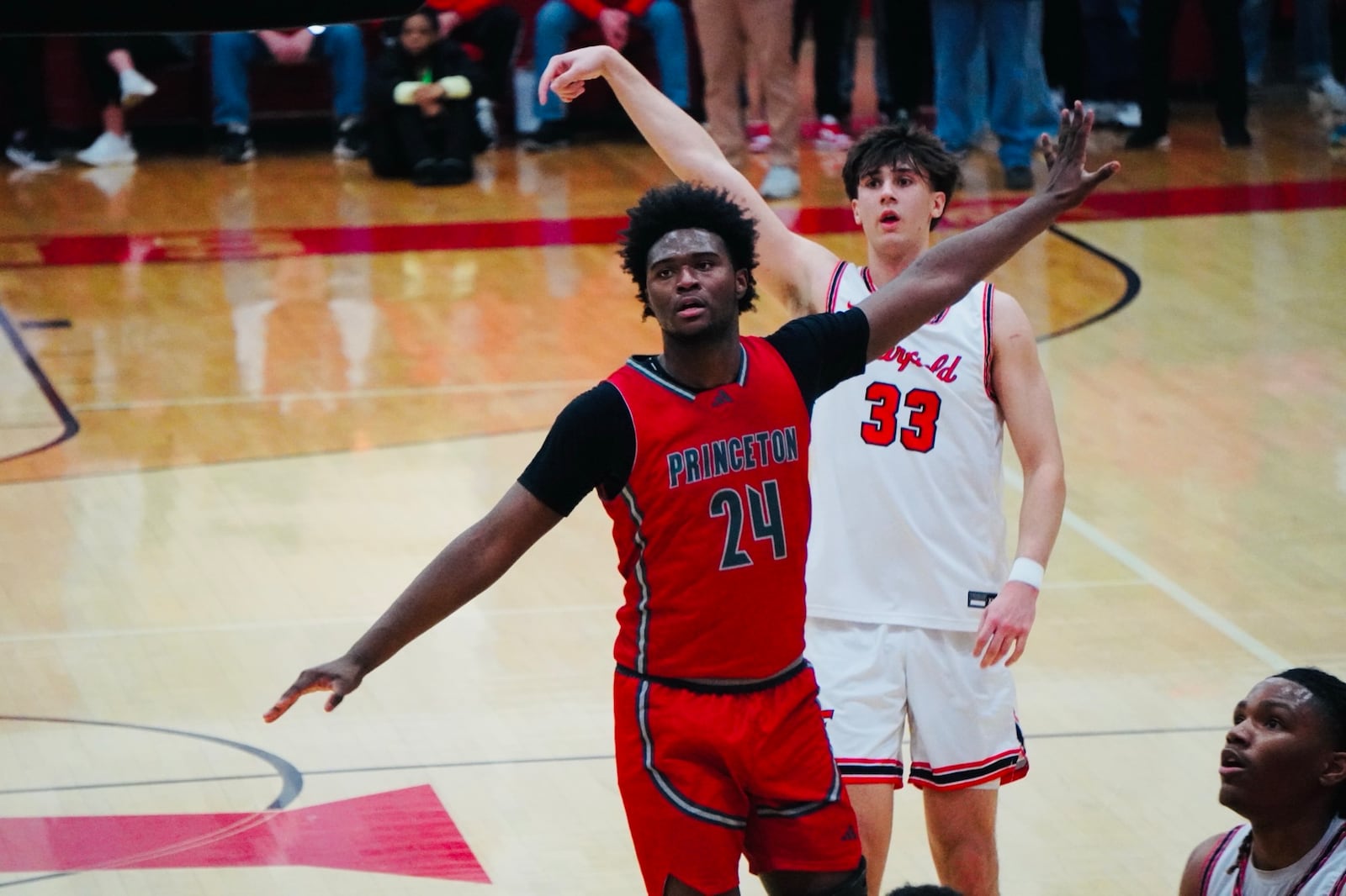 Fairfield's Gabe Clemmons (33) puts up a shot over Princeton's Kieran Granville-Britten (24) on Friday night at Fairfield Arena. Chris Vogt/CONTRIBUTED