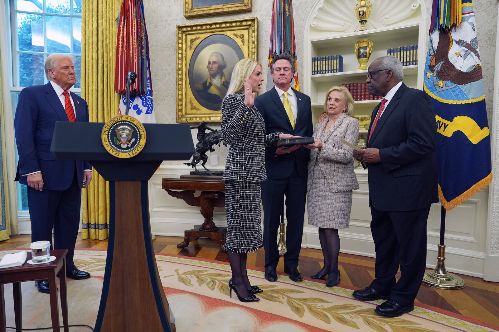 Pam Bondi is sworn in as Attorney General by Supreme Court Associate Justice Clarence Thomas, right, as President Donald Trump, John Wakefield and Patsy Bondi, look on, in the Oval Office of the White House, Wednesday, Feb. 5, 2025, in Washington. (AP Photo/Evan Vucci)