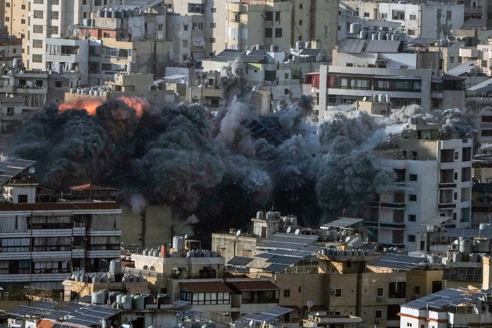 Flame and smoke rise after an Israeli airstrike on Dahiyeh, in the southern suburb of Beirut, Lebanon, Saturday, Nov. 16, 2024. (AP Photo/Bilal Hussein)