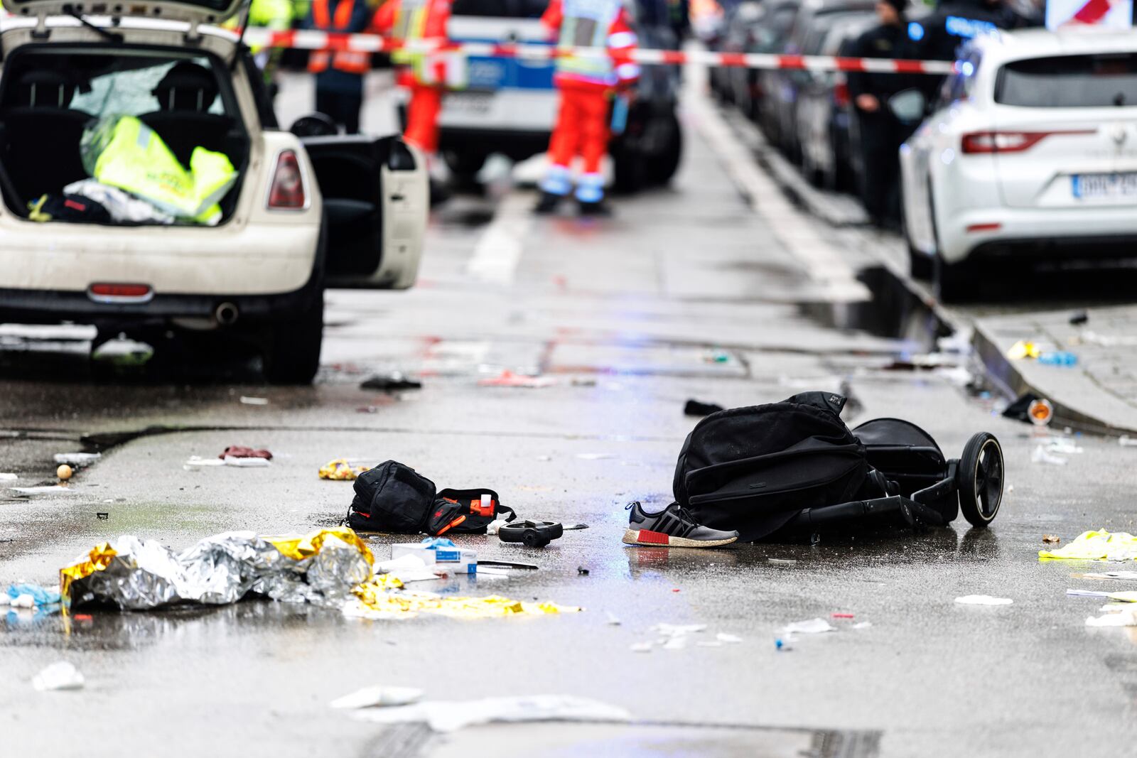 Emergency services attend the scene of an accident after a driver hit a group of people in Munich, Germany, Thursday Feb. 13, 2025. (Matthias Balk/dpa via AP)