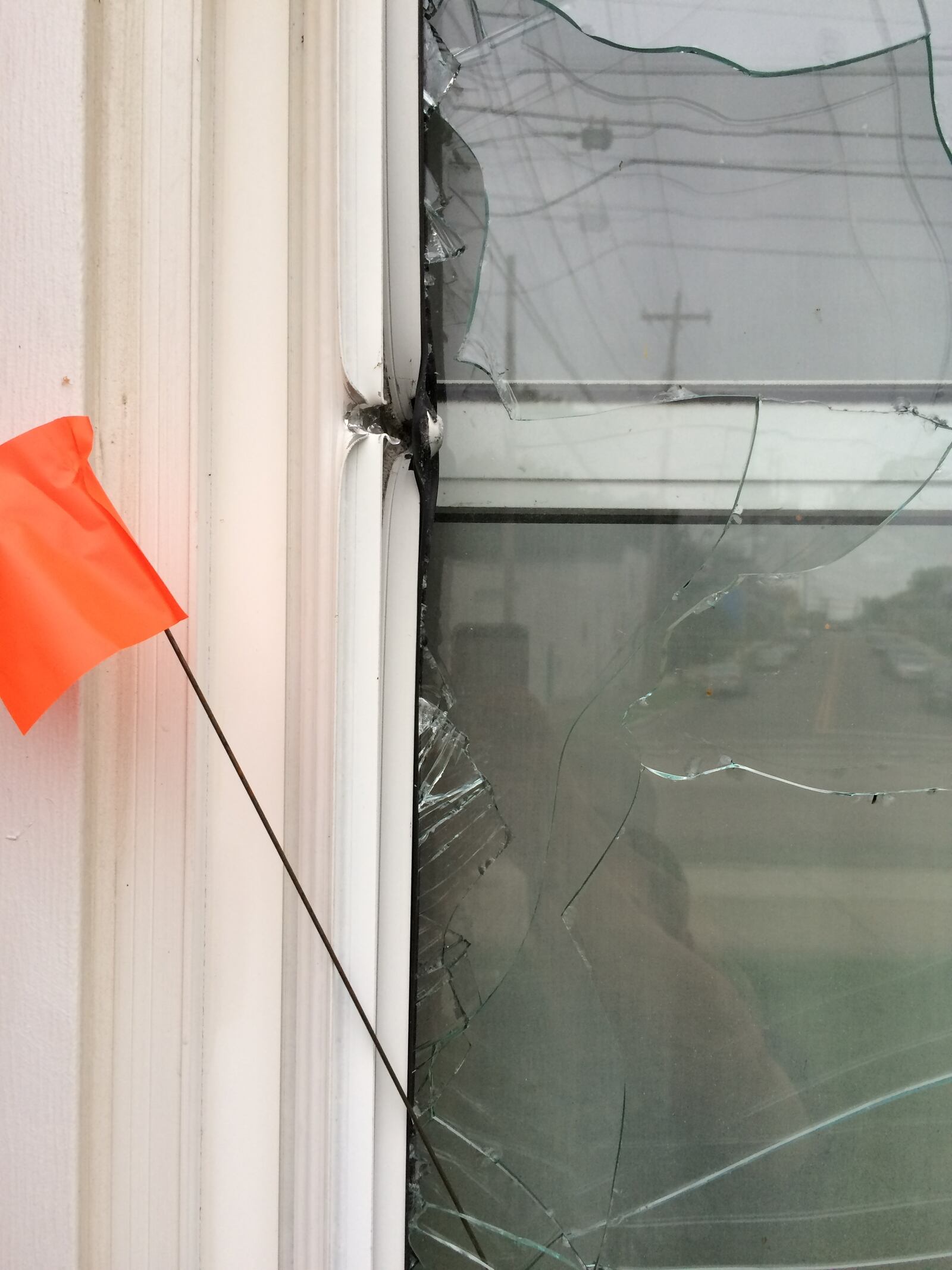 An apartment window after bullets hit it Wednesday night in Hamilton.