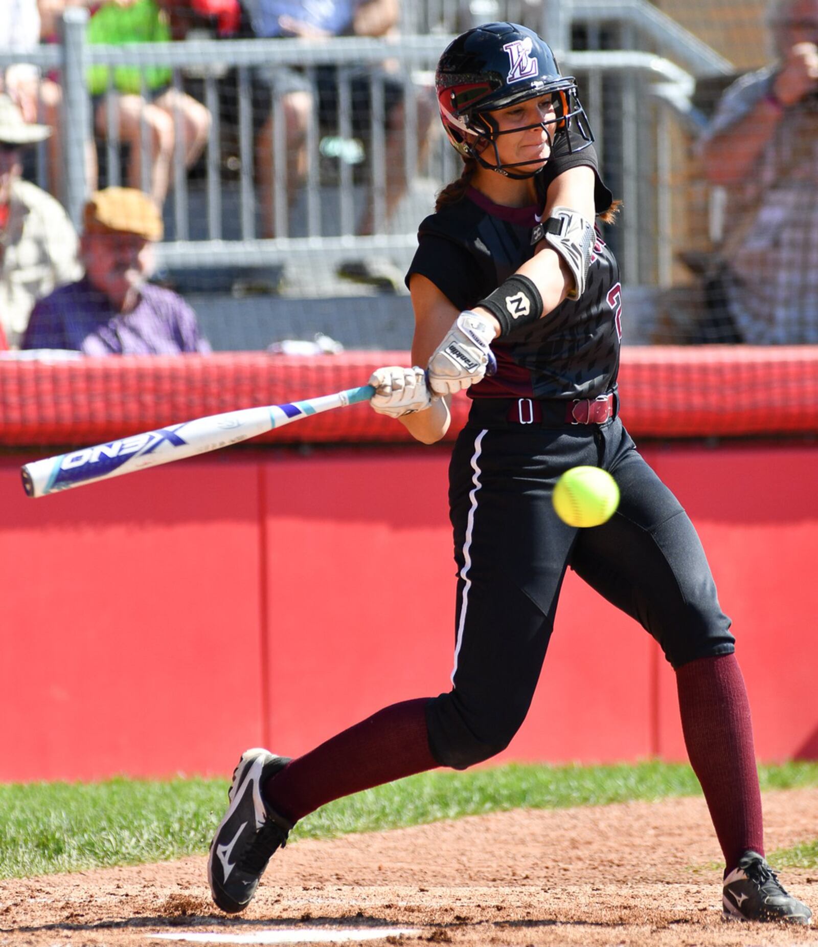 Lebanon’s Madison Hartman takes a swing in the first inning of the Division I state final against Elyria on Saturday at Firestone Stadium in Akron. CONTRIBUTED PHOTO BY BRYANT BILLING