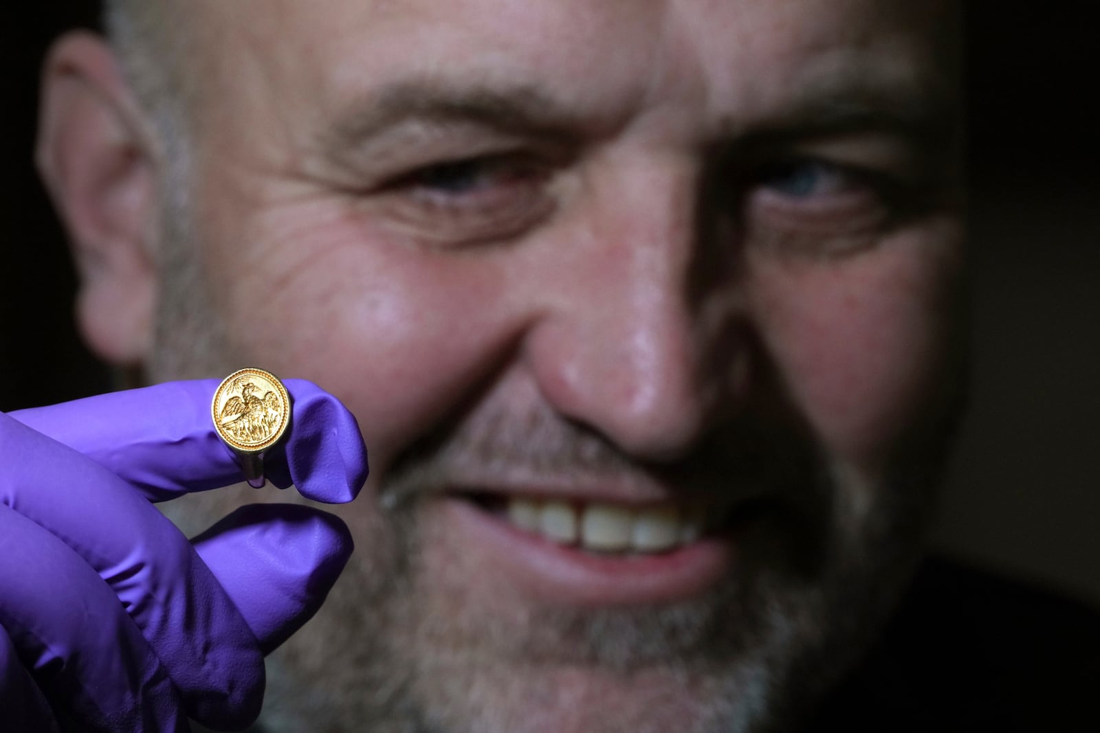 Andy Akroyd, detectorist who found the item, displays a medieval gold signet ring linked to Queen Elizabeth I, at the British Museum's annual treasure launch in London, Tuesday, Feb. 11, 2025. (AP Photo/Kirsty Wigglesworth)