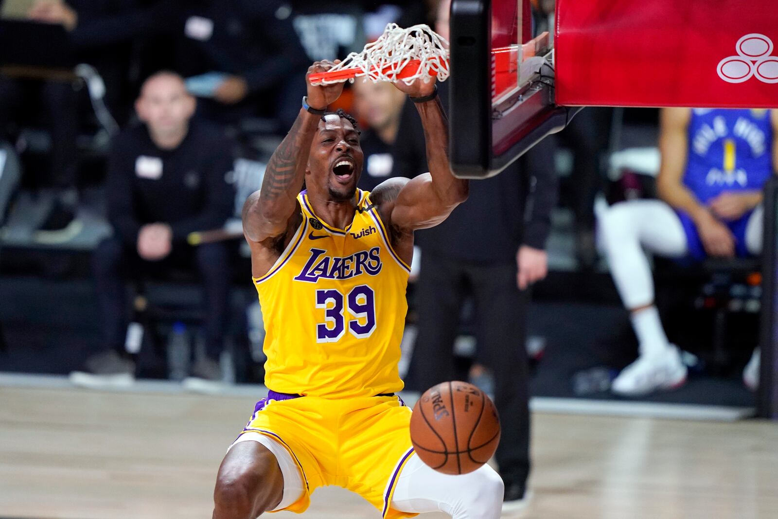 FILE - Los Angeles Lakers center Dwight Howard (39) dunks the ball during the second half an NBA conference final playoff basketball game against the Denver Nuggets on Friday, Sept. 18, 2020, in Lake Buena Vista, Fla. (AP Photo/Mark J. Terrill, File)