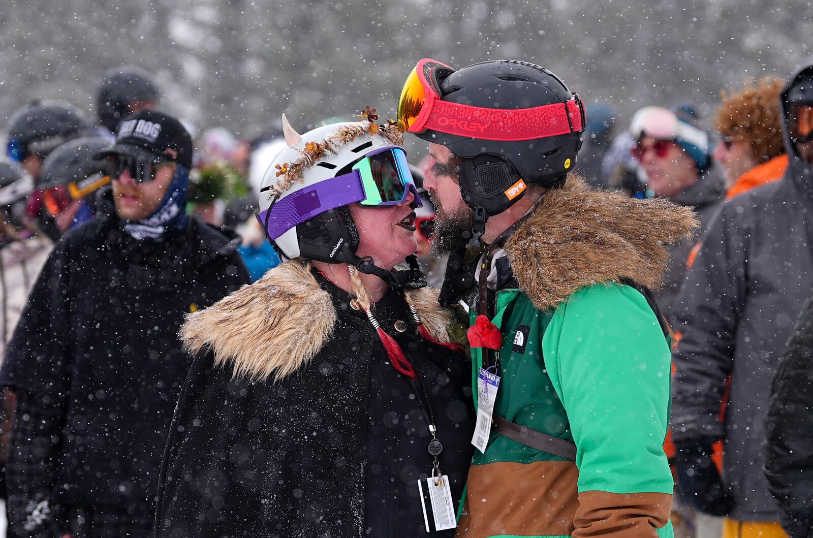 Kristina Hill and her husband of 16 years, Justin, kiss at the 35th annual Marry Me & Ski for Free Valentine's Day mountaintop matrimony ceremony, Friday, Feb. 14, 2025, at Loveland Ski Area, Colo. (AP Photo/David Zalubowski)