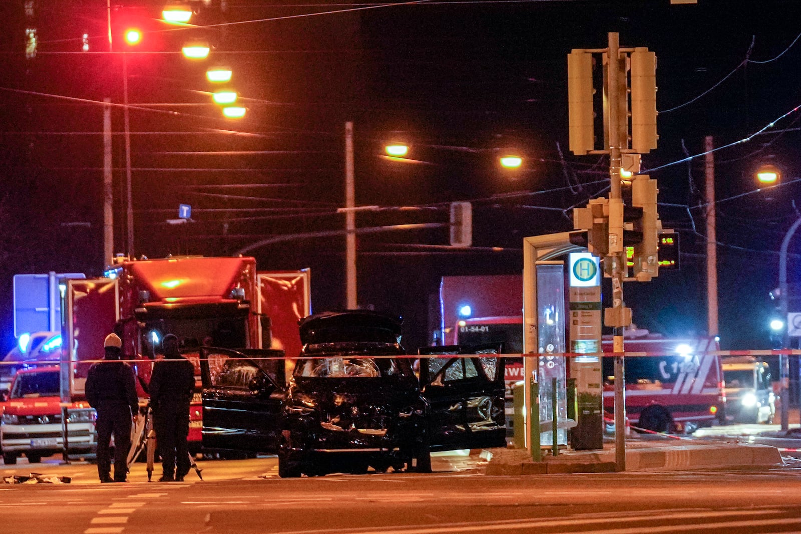 The car that was crashed into a crowd of people at the Magdeburg Christmas market is seen following the attack in Magdeburg, Germany, Saturday early morning, Dec. 21, 2024. (AP Photo/Ebrahim Noroozi)