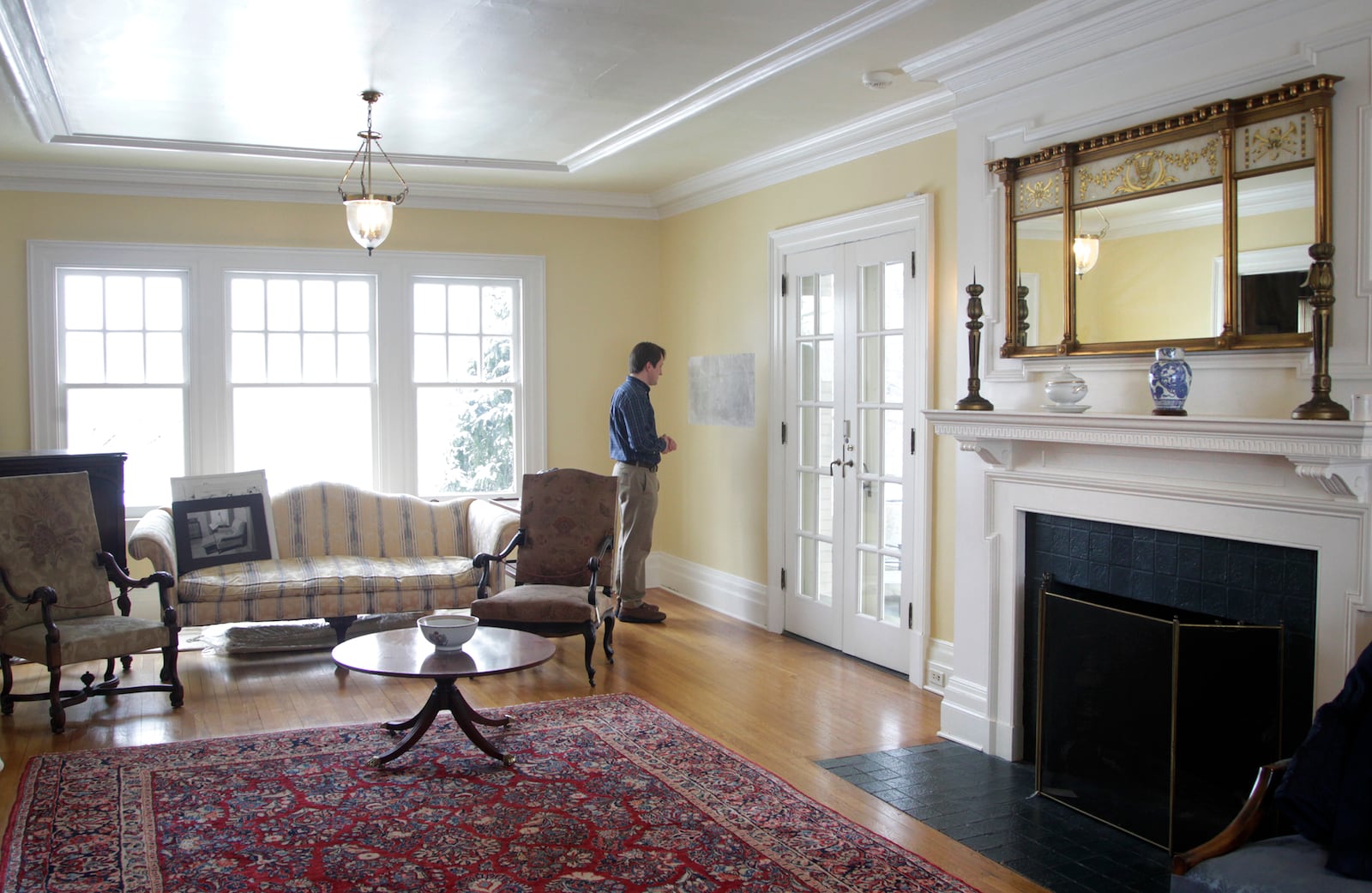 Alex Heckman, vice-president of museum operations for Dayton History, looks over newly discovered messages written on plaster at Hawthorn Hill, Orville Wright's Oakwood mansion. LISA POWELL / STAFF