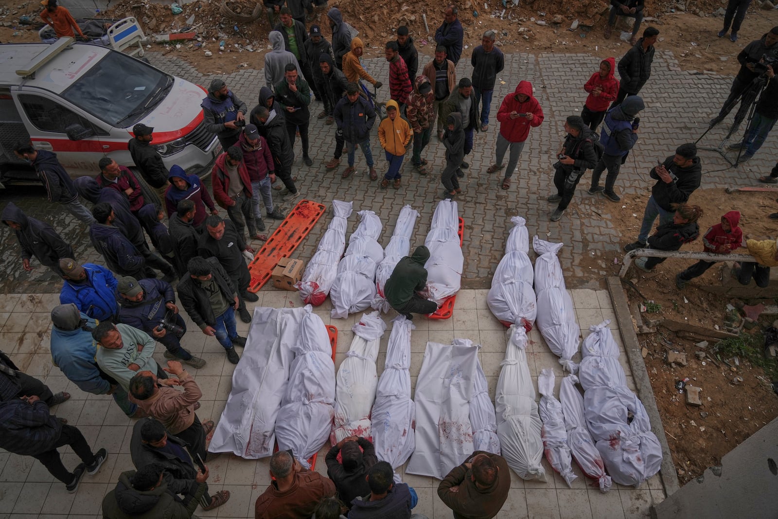 The bodies of victims of an Israeli army airstrike are prepared for burial at Indonesia Hospital in Beit Lahia, northern Gaza Strip, Thursday, March 20, 2025. (AP Photo/Jehad Alshrafi)