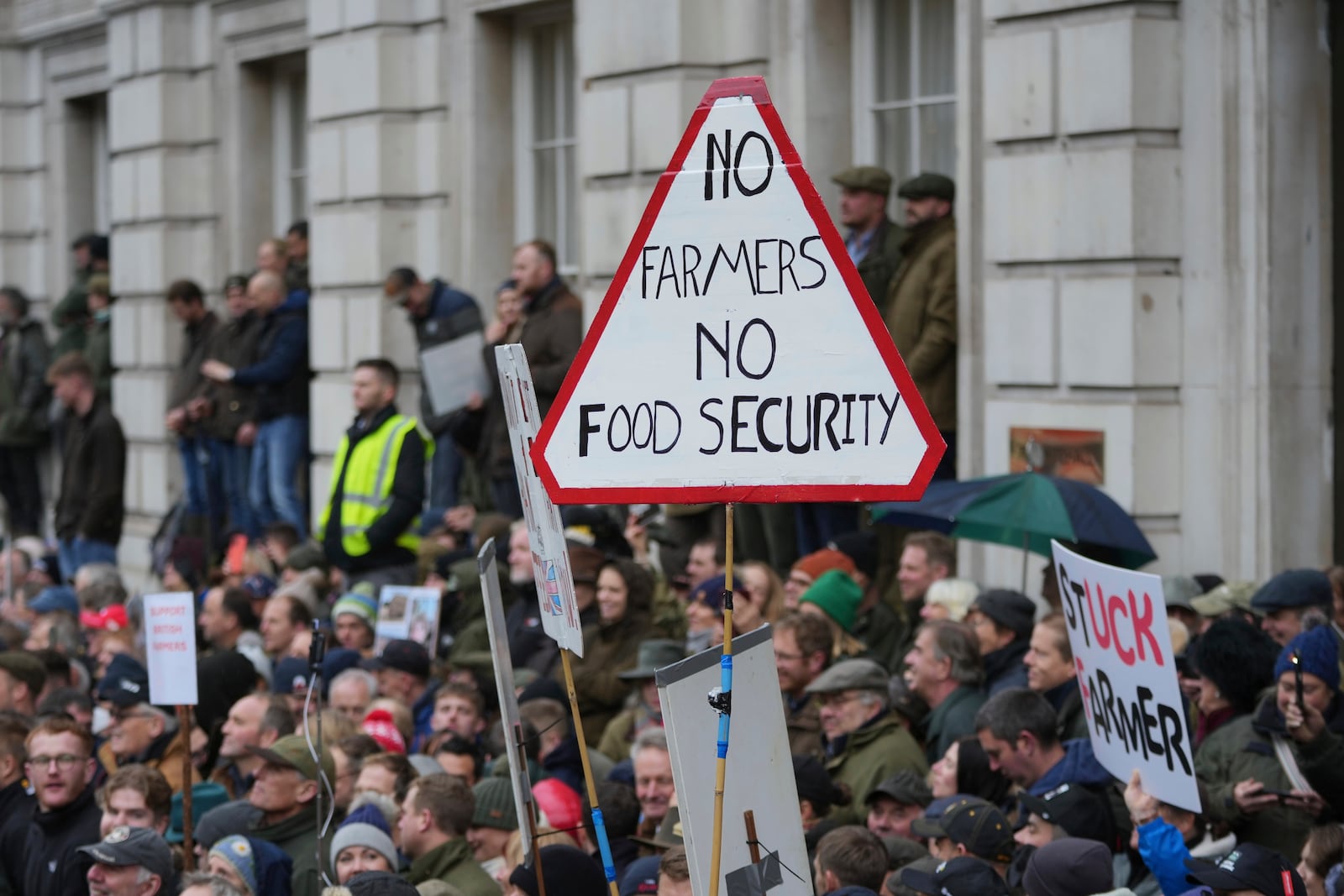 The National Farmers' Union members attend a protest against the planned changes to tax rules, in London, Tuesday, Nov. 19, 2024. (AP Photo/Kin Cheung)