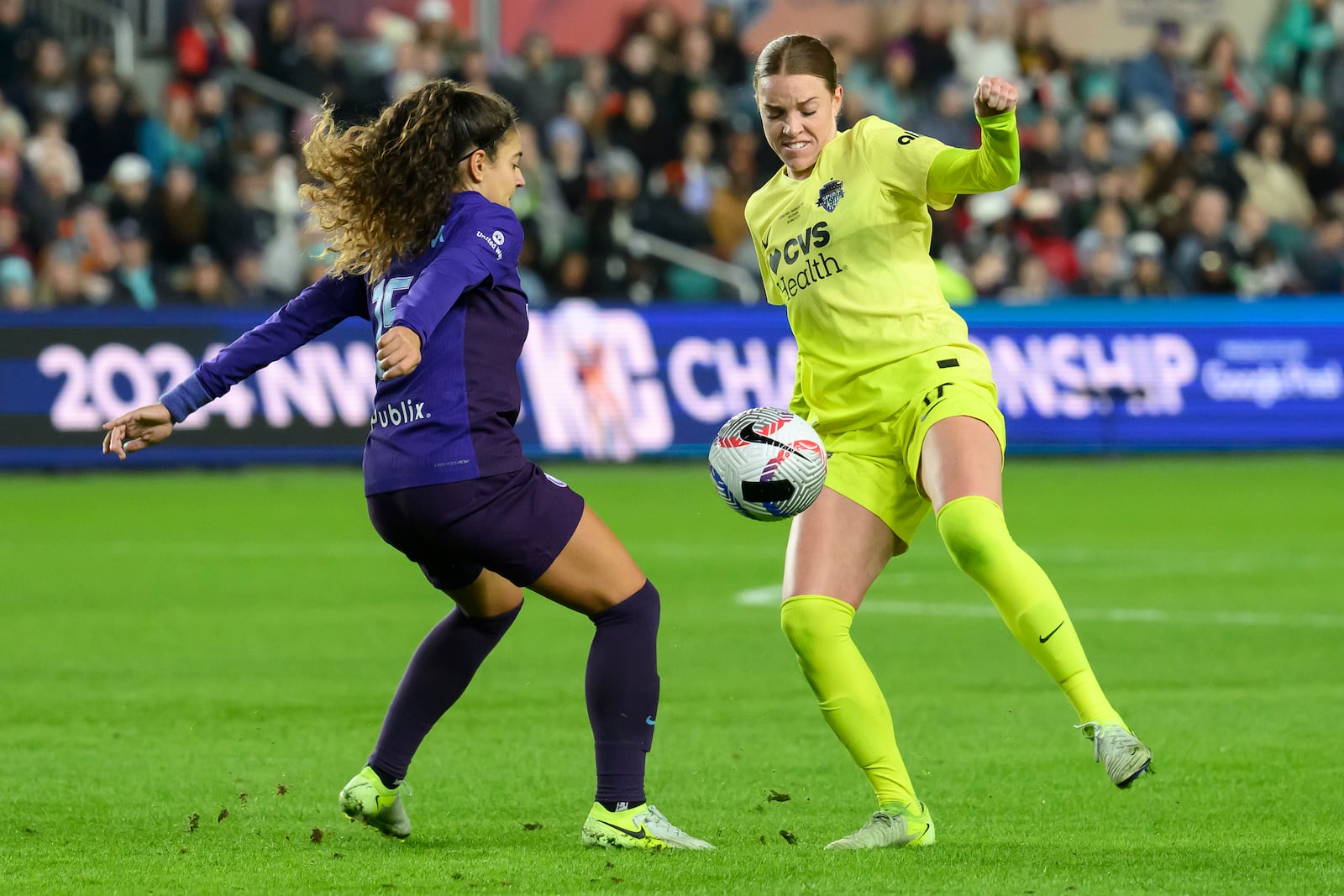 Orlando Pride midfielder Angelina, left, battles Washington Spirit midfielder Hal Hershfelt, right, for a ball during the first half of the NWSL championship at CPKC Stadium, Saturday, Nov. 23, 2024, in Kansas City, Mo. (AP Photo/Reed Hoffmann)