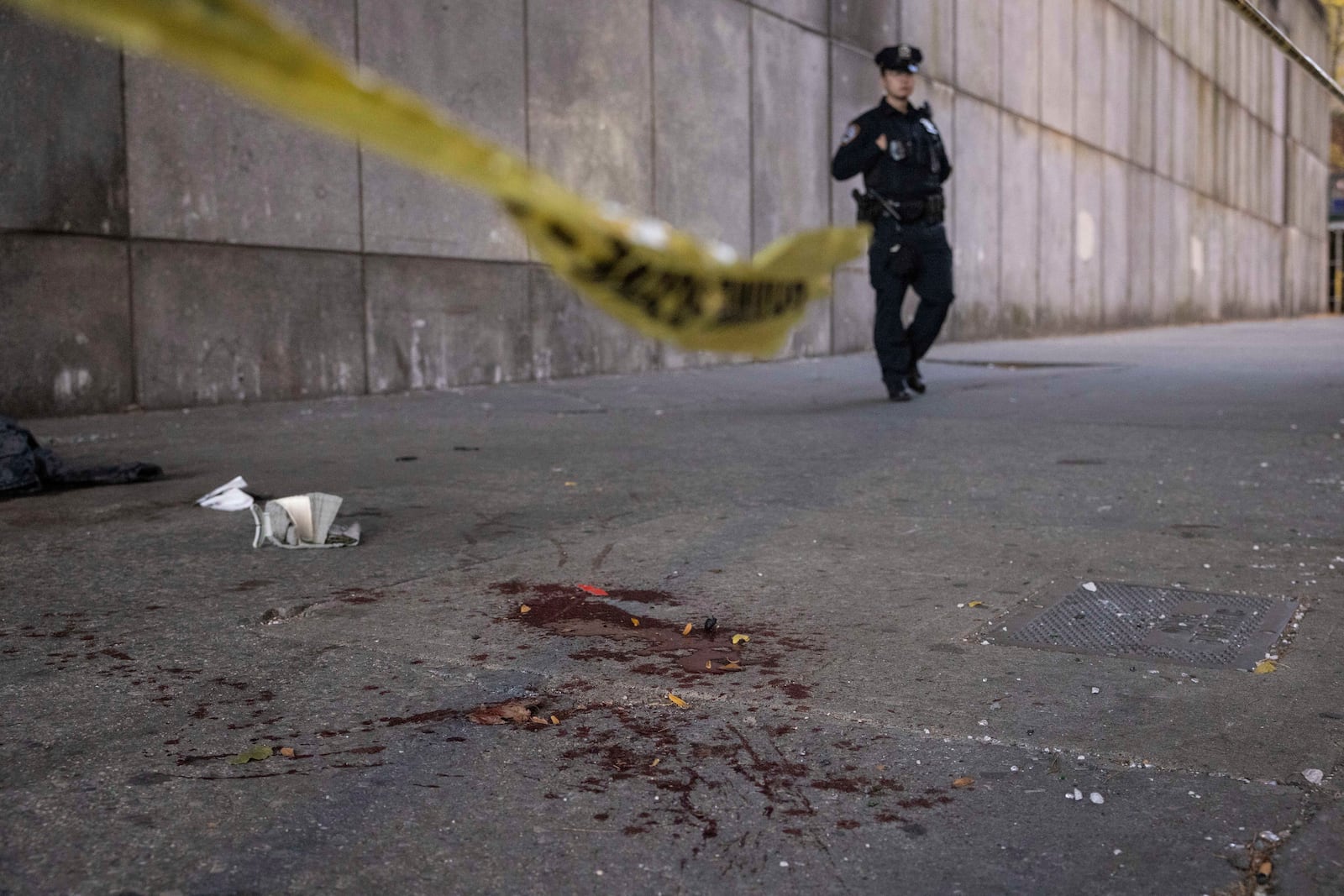 Blood stains is the ground at the site of stabbing spree near the United Nations Headquarters in New York, Monday, Nov. 18, 2024. (AP Photo/Yuki Iwamura)