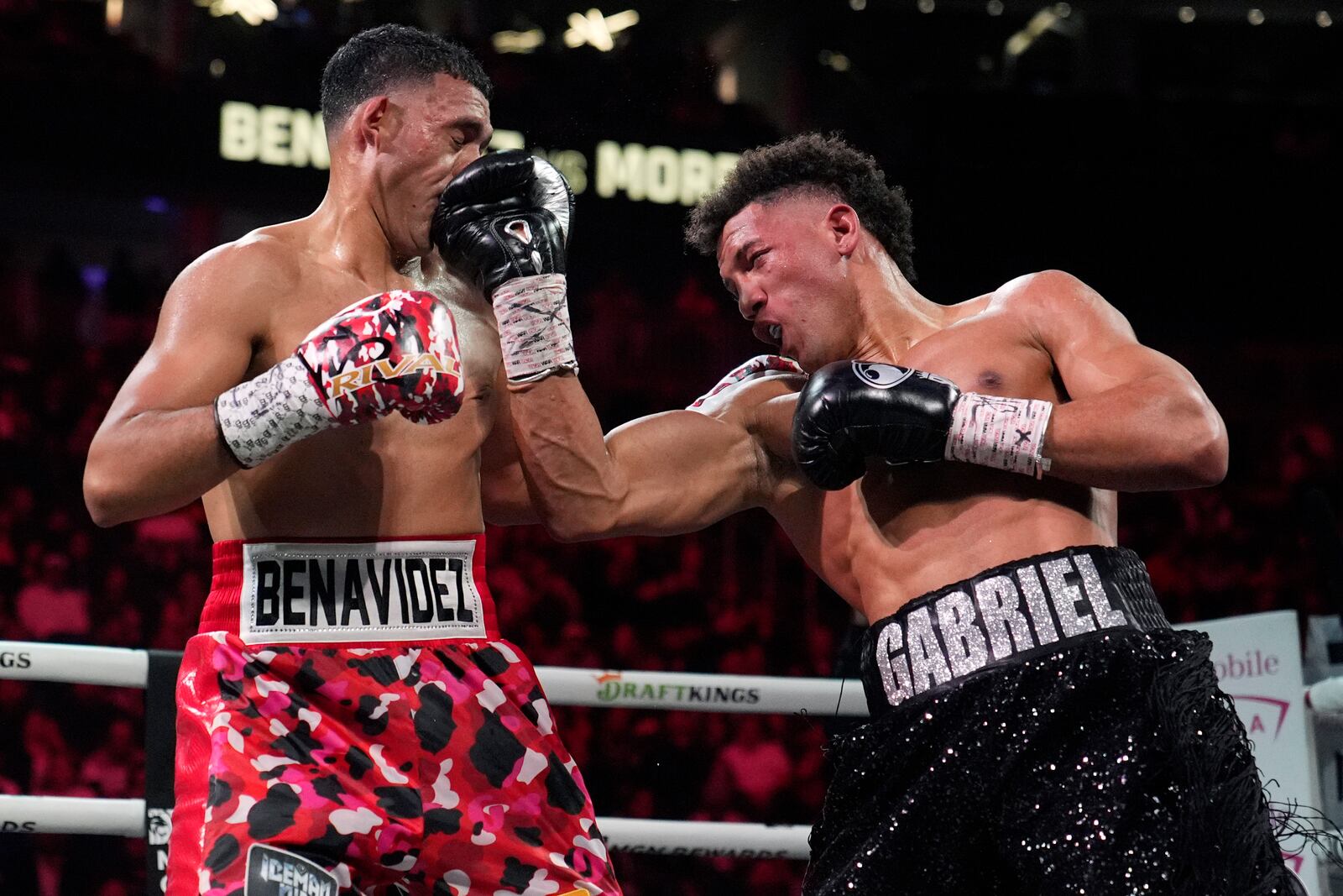 David Morrell hits David Benavidez during a light heavyweight title boxing match Saturday, Feb. 1, 2025, in Las Vegas. (AP Photo/John Locher)