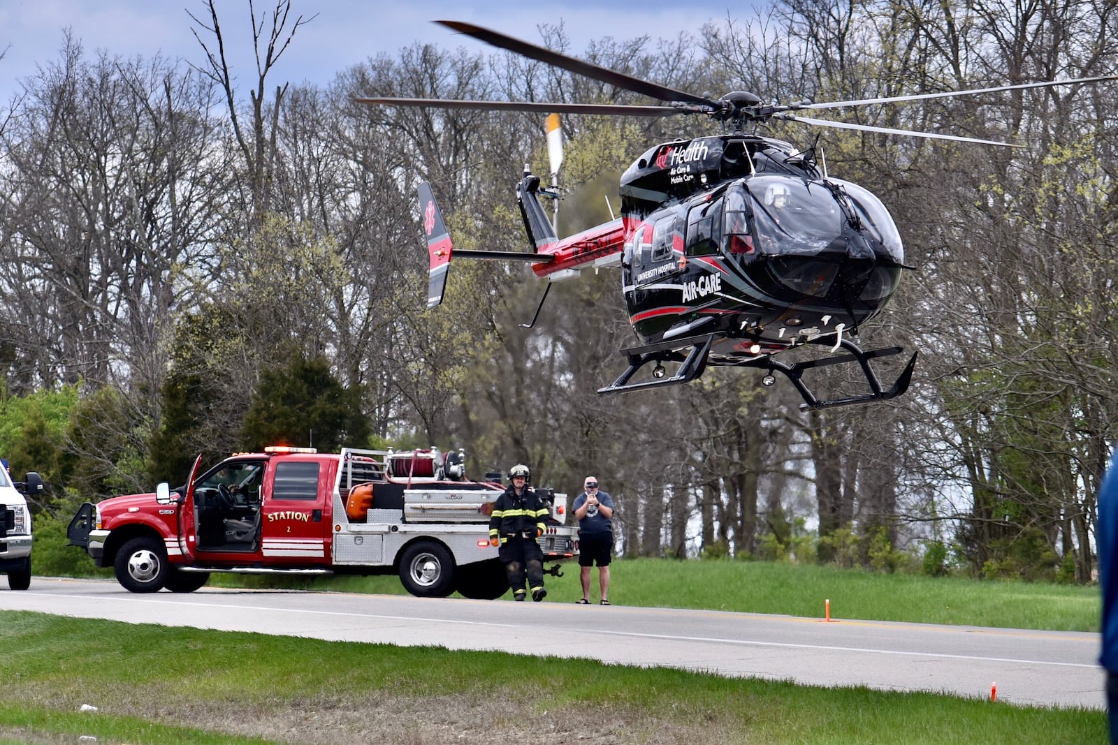 Emergency units work to remove a truck that slammed into a Monroe house this morning NICK GRAHAM/STAFF