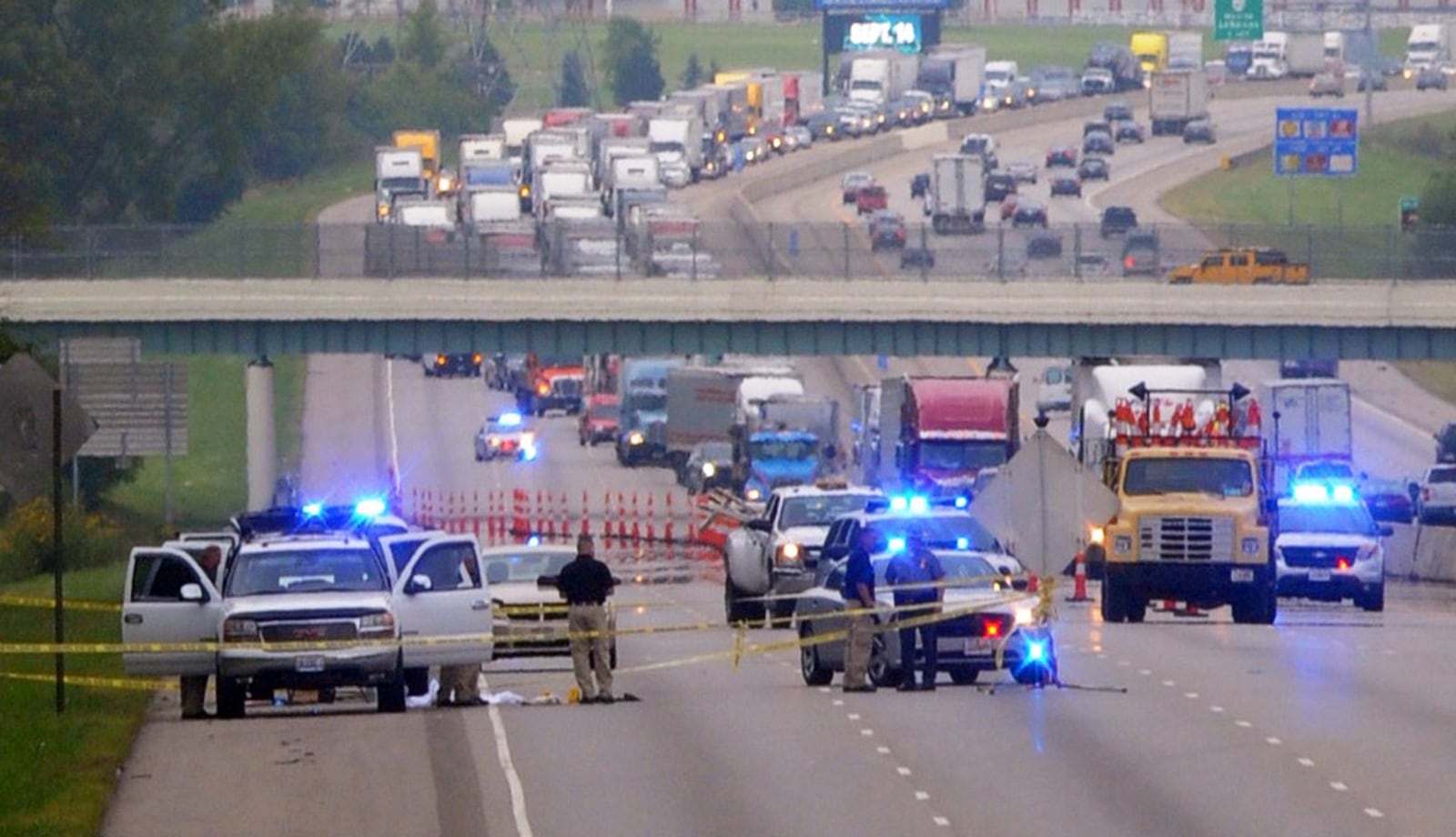 Interstate 75 was shut down in the northbound lanes between Ohio 63 and Ohio 122 due to a shooting incident Friday, Sept. 12, 2014. A teenage boy and his mother are dead following a tragic domestic situation Friday that started at their Kentucky home and ended with a traffic stop on Interstate 75 near Middletown. The Warren County Coroner’s Office confirmed Kim Thomas, 34, of Mayfield, Ky., was found deceased in the back of her ex-boyfriend Terry Froman’s white SUV near mile marker 31 on northbound I-75. She was found naked and bloody, and likely was shot multiple times, Deputy Coroner Doyle Burke said. Marshall Gorby / Staff