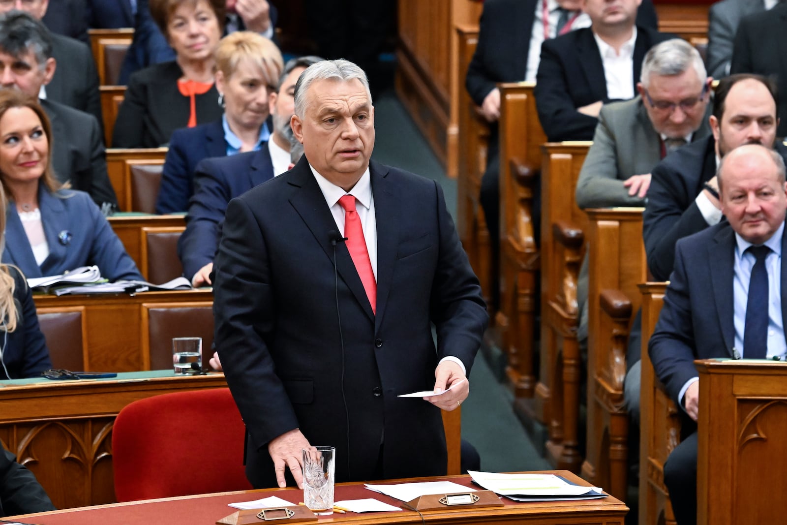 Hungarian Prime Minister Viktor Orban responds to speeches at the start of the spring session of the National Assembly in Budapest, Hungary, Monday, Feb. 24, 2025. (Zoltan Mathe/MTI via AP)