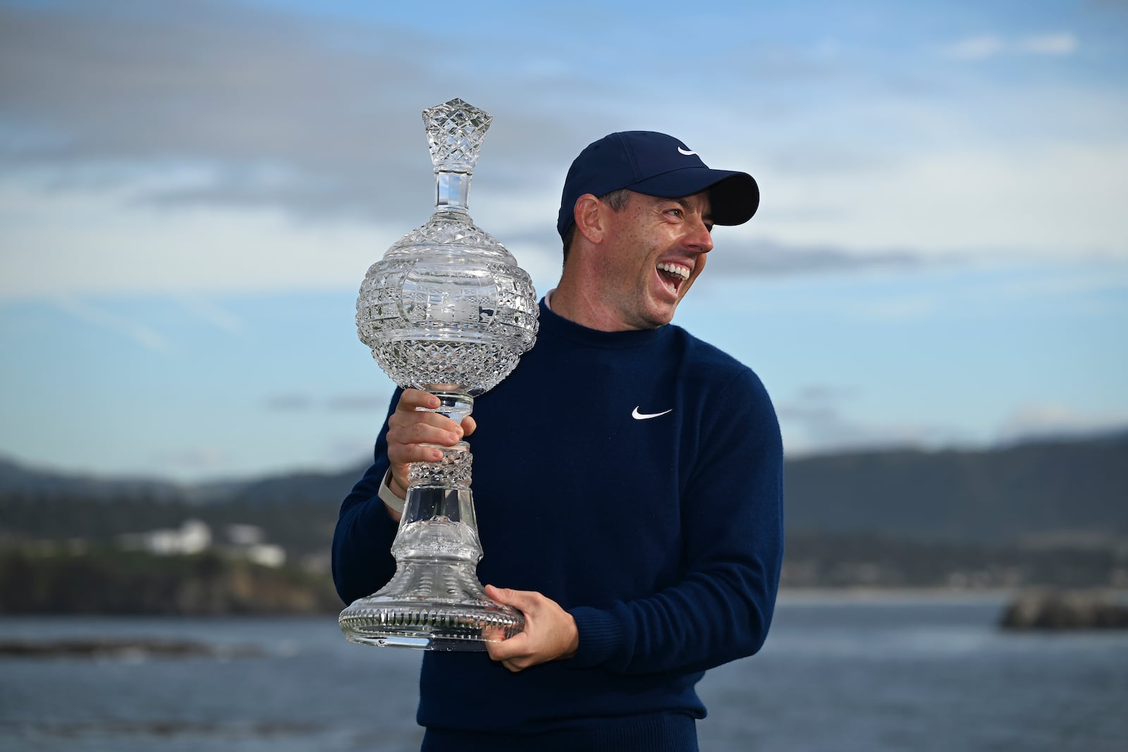 Rory McIlroy, of Northern Ireland, celebrates at Pebble Beach Golf Links after winning the AT&T Pebble Beach Pro-Am golf tournament, Sunday, Feb. 2, 2025, in Pebble Beach, Calif. (AP Photo/Nic Coury)