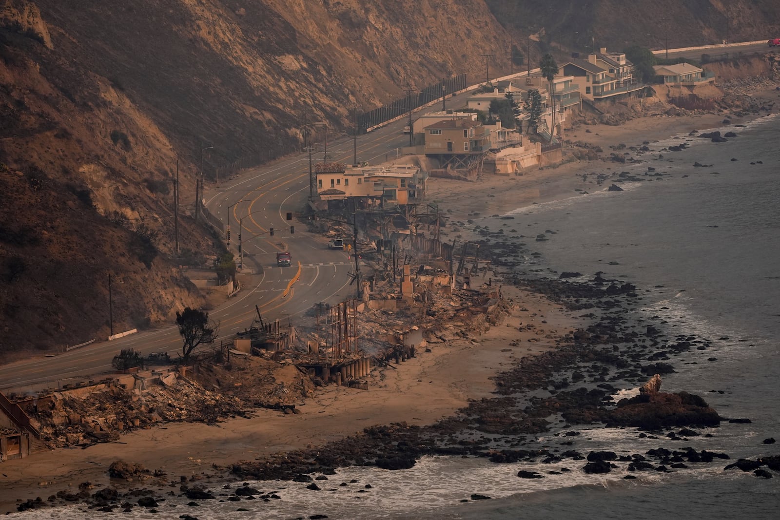 Beach front properties are left destroyed by the Palisades Fire, in this aerial view, Thursday, Jan. 9, 2025 in Malibu, Calif. (AP Photo/Mark J. Terrill)