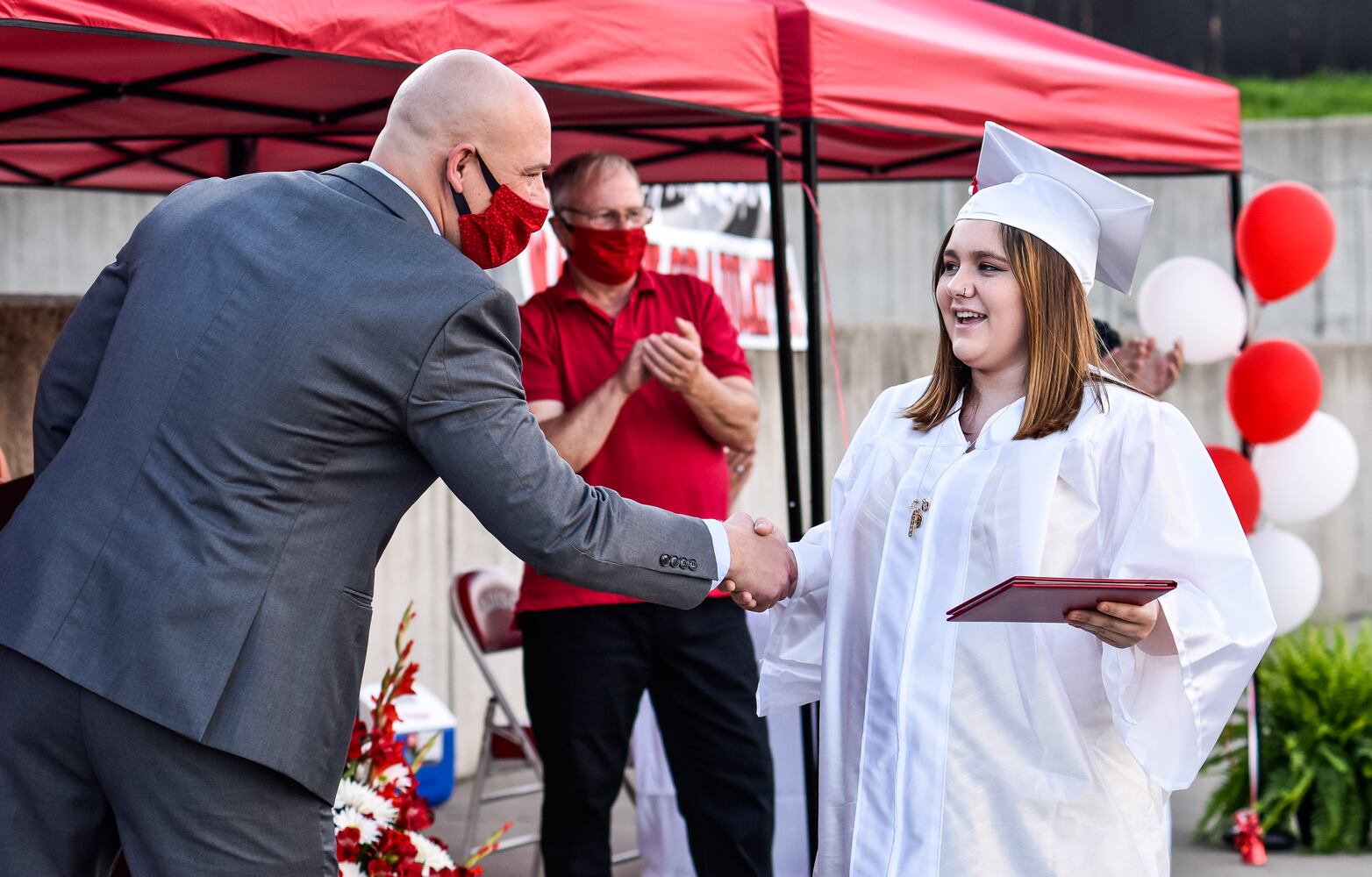 Madison High School drive-thru graduation ceremony at Land of Illusion