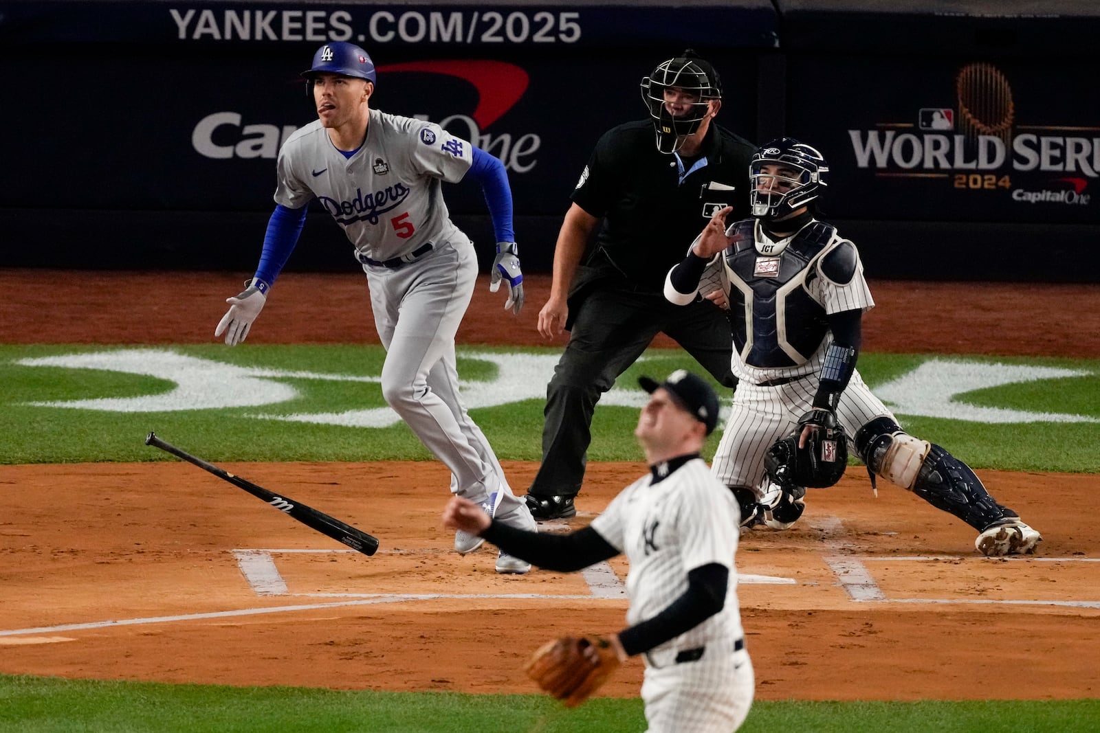 Los Angeles Dodgers' Freddie Freeman hits a two-run home run against the New York Yankees during the first inning in Game 3 of the baseball World Series, Monday, Oct. 28, 2024, in New York. (AP Photo/Frank Franklin II)