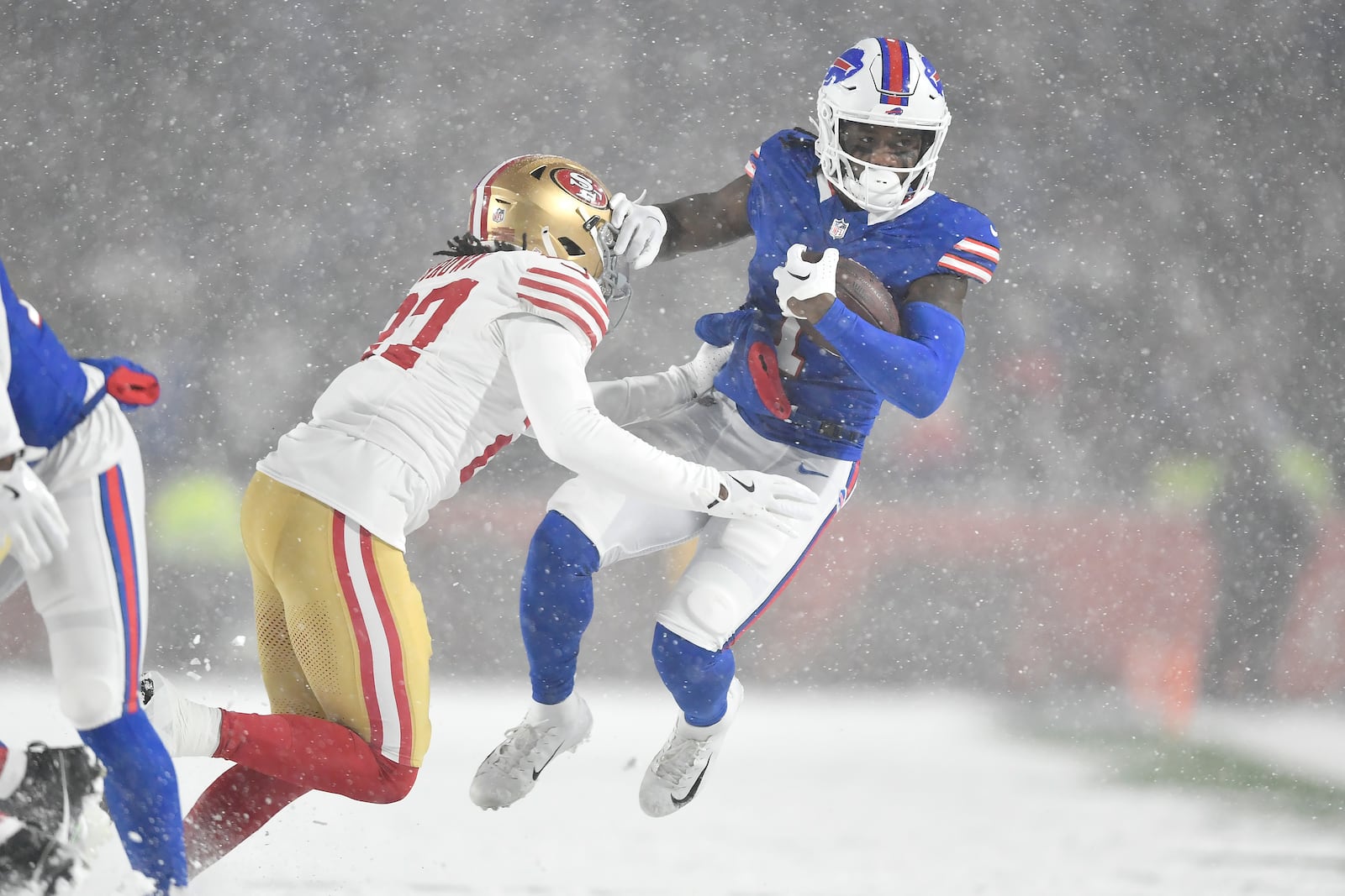 Buffalo Bills wide receiver Curtis Samuel, right, is tackled by San Francisco 49ers safety Ji'Ayir Brown during the second half of an NFL football game in Orchard Park, N.Y., Sunday, Dec. 1, 2024. (AP Photo/Adrian Kraus)