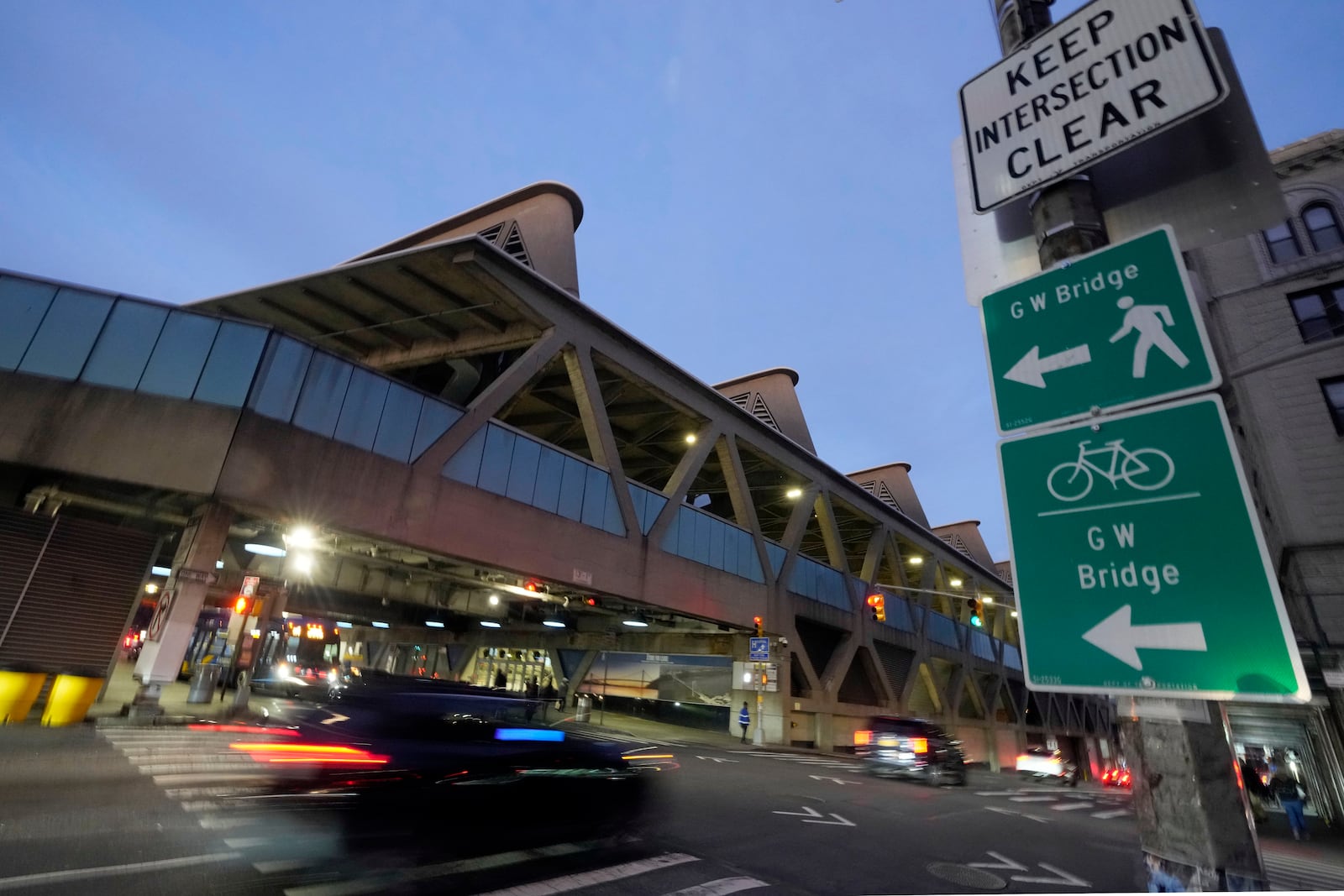 Traffic rolls past the George Washington Bridge Bus Station in New York, Friday, Dec. 6, 2024, where the gunman fleeing Wednesday's shooting of UnitedHealthcare CEO Brian Thompson took a taxi to, according to surveillance video. (AP Photo/Richard Drew)