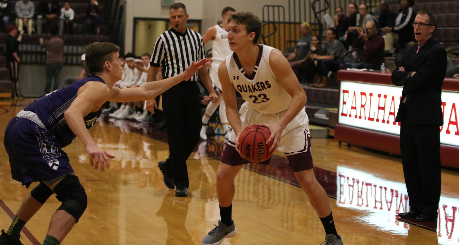 Earlham College’s Austin Doliboa (23) looks to make a pass during a 95-81 loss to visiting Kenyon on Nov. 15, 2017, in Richmond, Ind. PHOTO COURTESY OF EARLHAM ATHLETICS