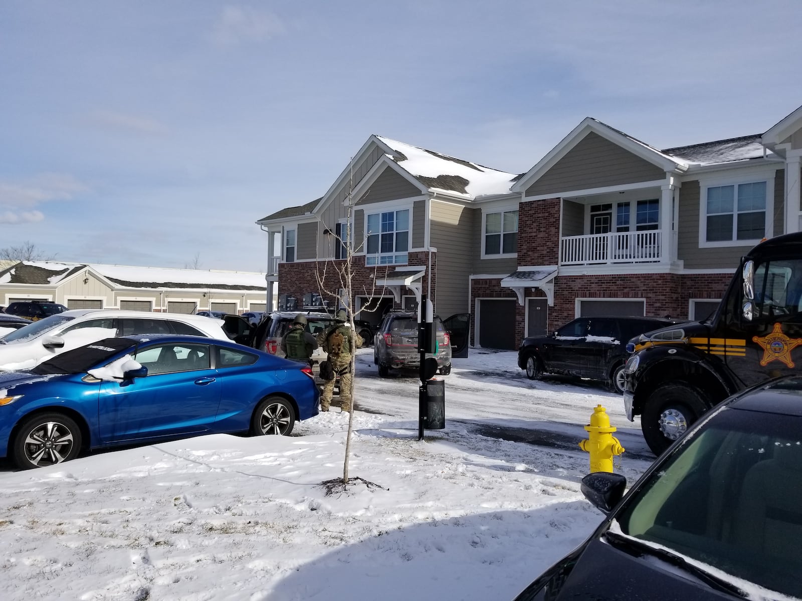 SWAT team assembles outside a townhouse where a man held a 10-year-old boy hostage in Liberty Twp. on Saturday, Jan. 13, 2018. CONTRIBUTED