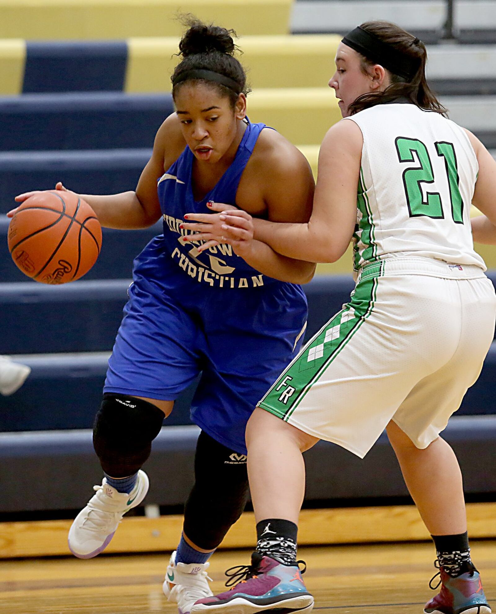 Middletown Christian’s Aubriana Bellard drives on Fayetteville’s Haley Moore on Tuesday night during Division IV sectional action at Monroe. CONTRIBUTED PHOTO BY E.L. HUBBARD