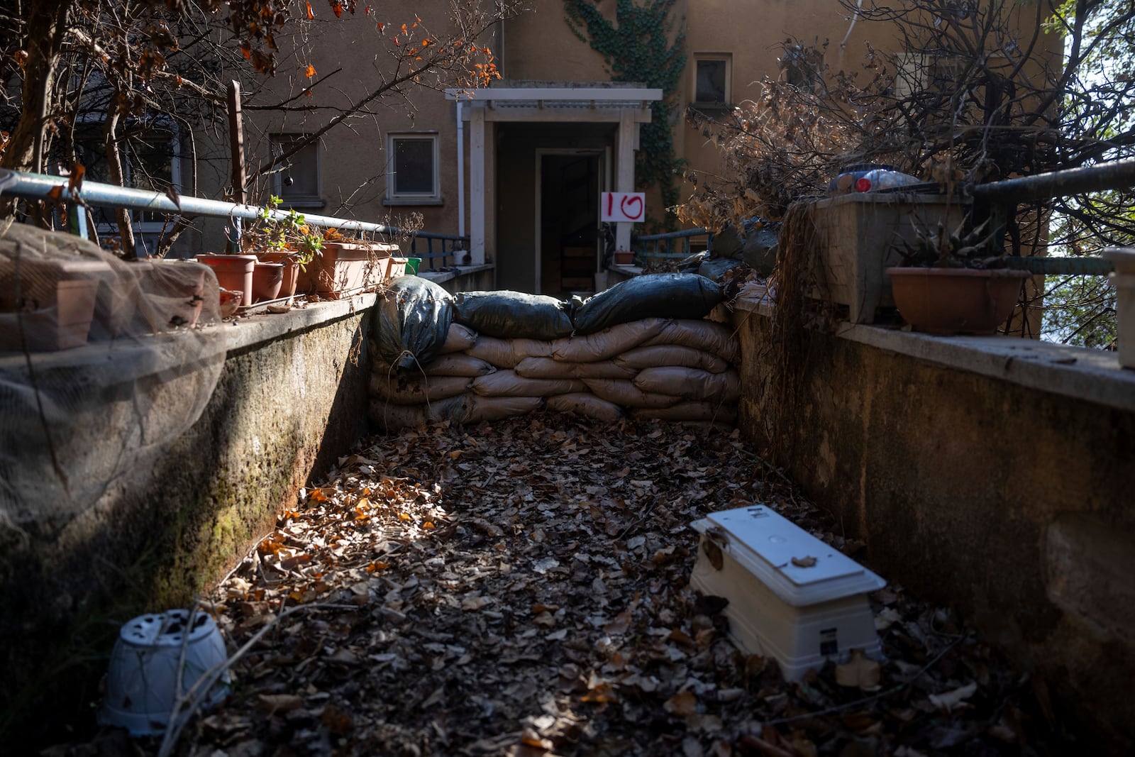 A house is blocked with protective sandbags in the community of Kibbutz Manara, located along the border with Lebanon, in northern Israel, Monday, Dec. 2, 2024. (AP Photo/Ohad Zwigenberg)