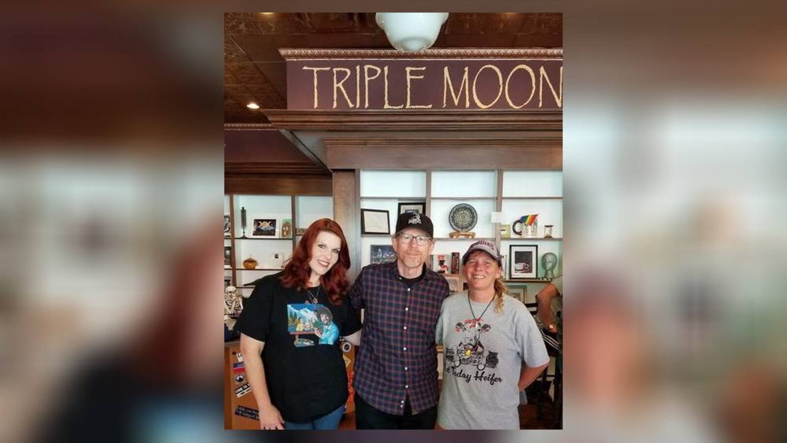 Ron Howard poses with Renae Theiss, left, manager of Triple Moon Coffee Co., and Heather Gibson, owner of the downtown Middletown business. PROVIDED PHOTO