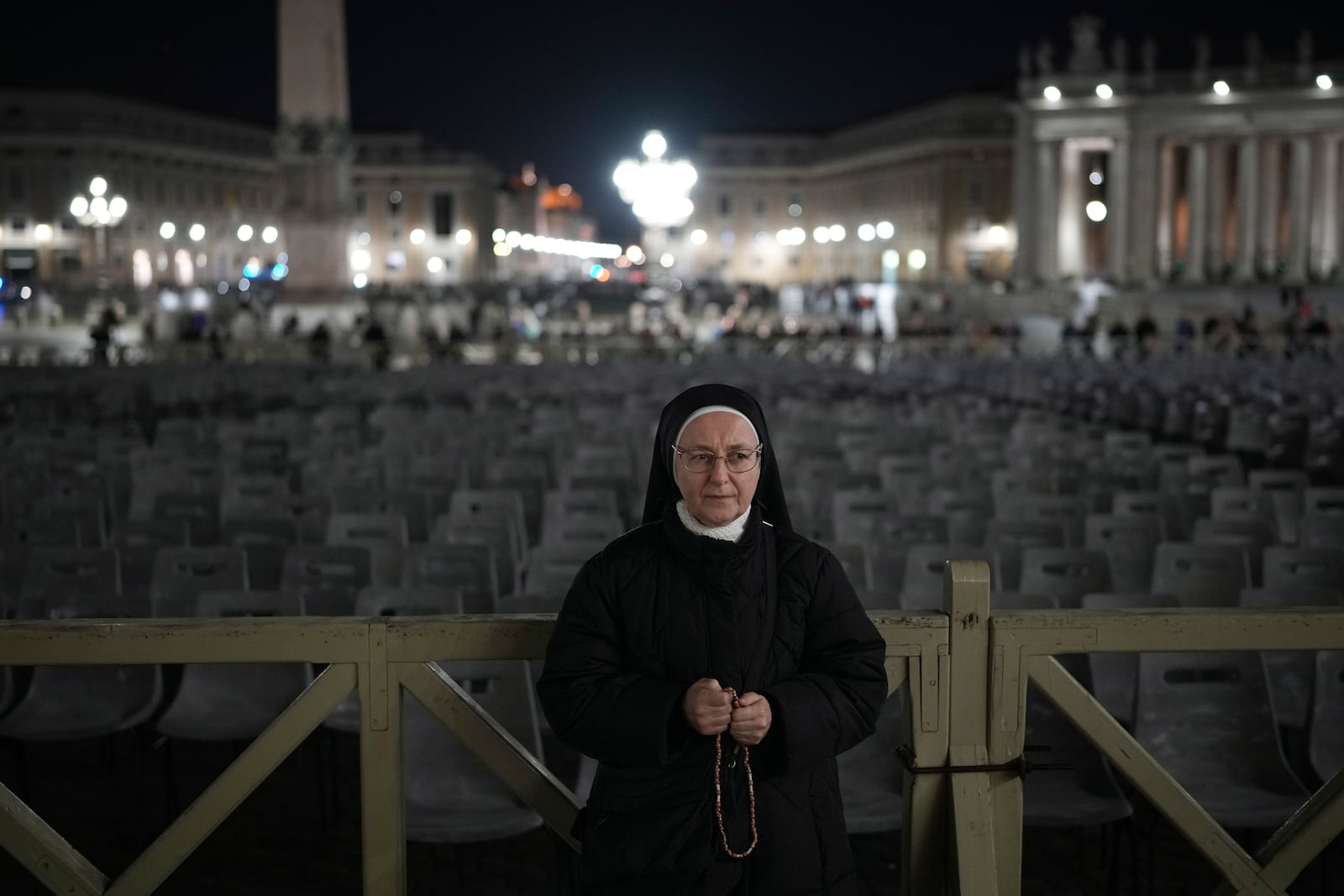 A nun prays during a rosary prayer for Pope Francis' health in St. Peter's Square at the Vatican, Thursday, Feb. 27, 2025. (AP Photo/Alessandra Tarantino)