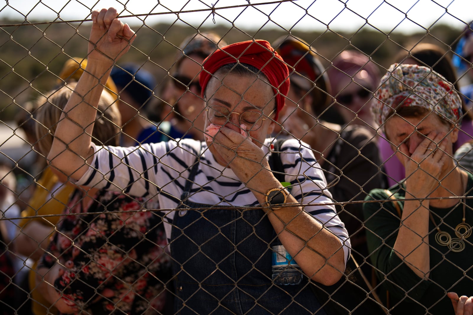 Relatives and friends mourn during the funeral of Israeli reservist Yedidia Bloch, 31, at Mevo Horon settlement, West Bank, Wednesday, Oct. 30, 2024. Bloch died on Tuesday 29 after he was injured in Lebanon. (AP Photo/Francisco Seco)