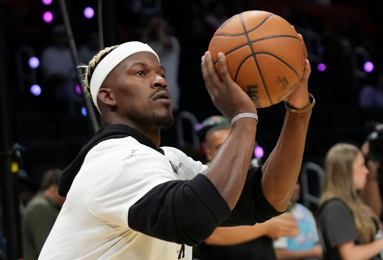 Miami Heat forward Jimmy Butler warms up before an NBA basketball game against the Denver Nuggets, Friday, Jan. 17, 2025, in Miami. (AP Photo/Lynne Sladky)