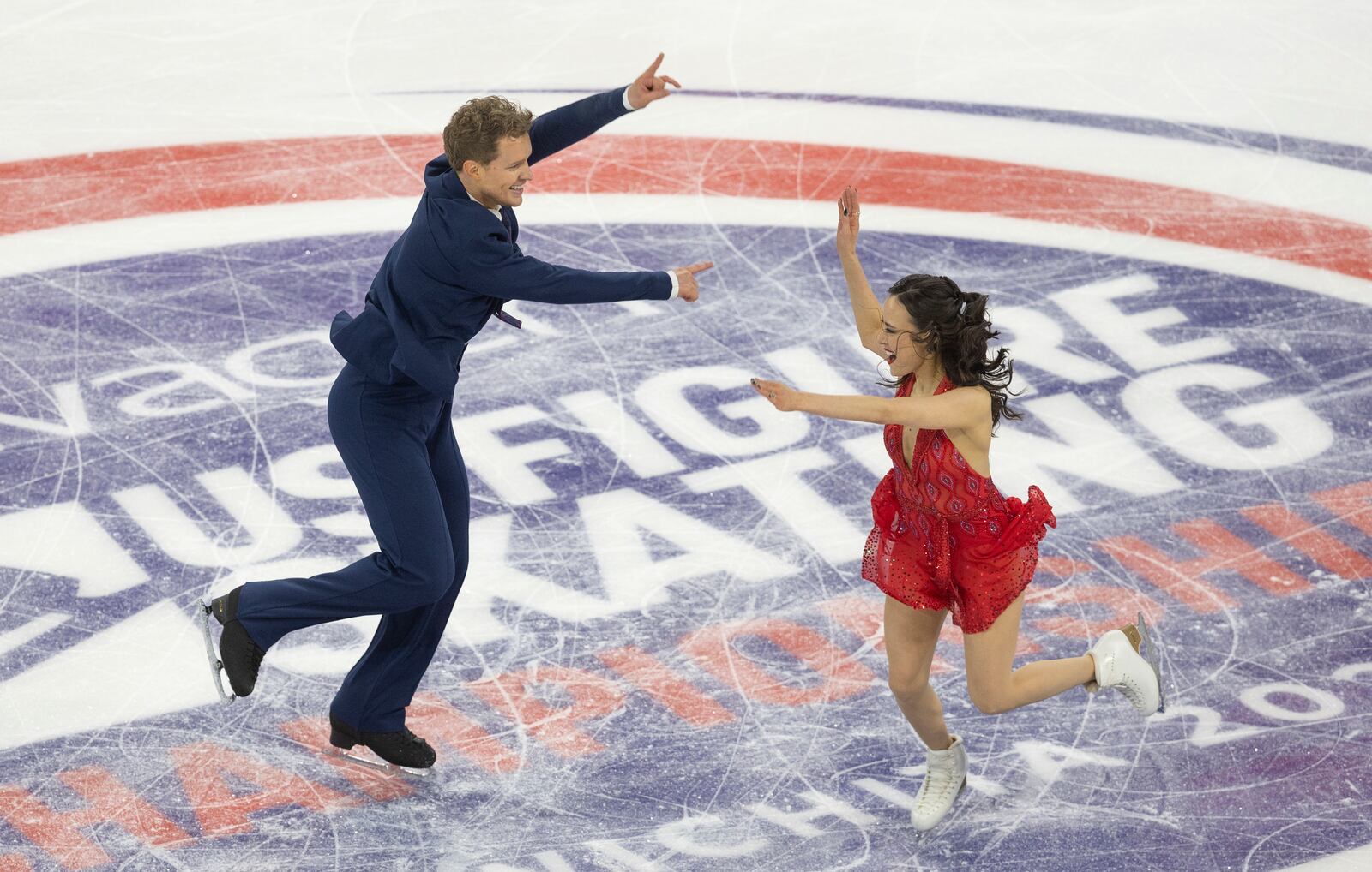 Madison Chock, right, and Evan Bates, left, perform during the ice dance rhythm dance competition at the U.S. figure skating championships Friday, Jan. 24, 2025, in Wichita, Kan. (AP Photo/Travis Heying)