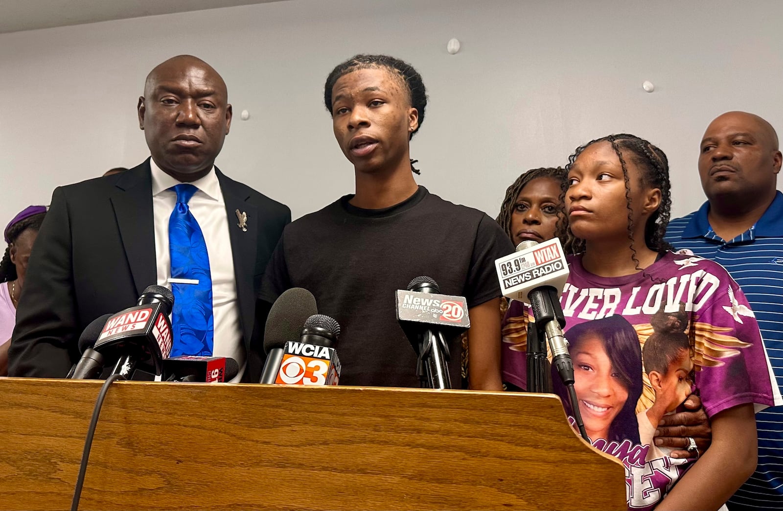 FILE - Malachi Hill Massey, 17, center, speaks at a news conference on Tuesday, July 23, 2024, at the NAACP headquarters in Springfield, Ill., about his mother, Sonya Massey, who was shot to death by a Sangamon County Sheriff's deputy on July 6 in Springfield after calling 911 for help. On the left is civil right attorney Ben Crump, who is representing the Massey family. On the right is Sonya Massey's daughter, Jeanette Summer Massey, 15. (AP Photo/John O'Connor, File)