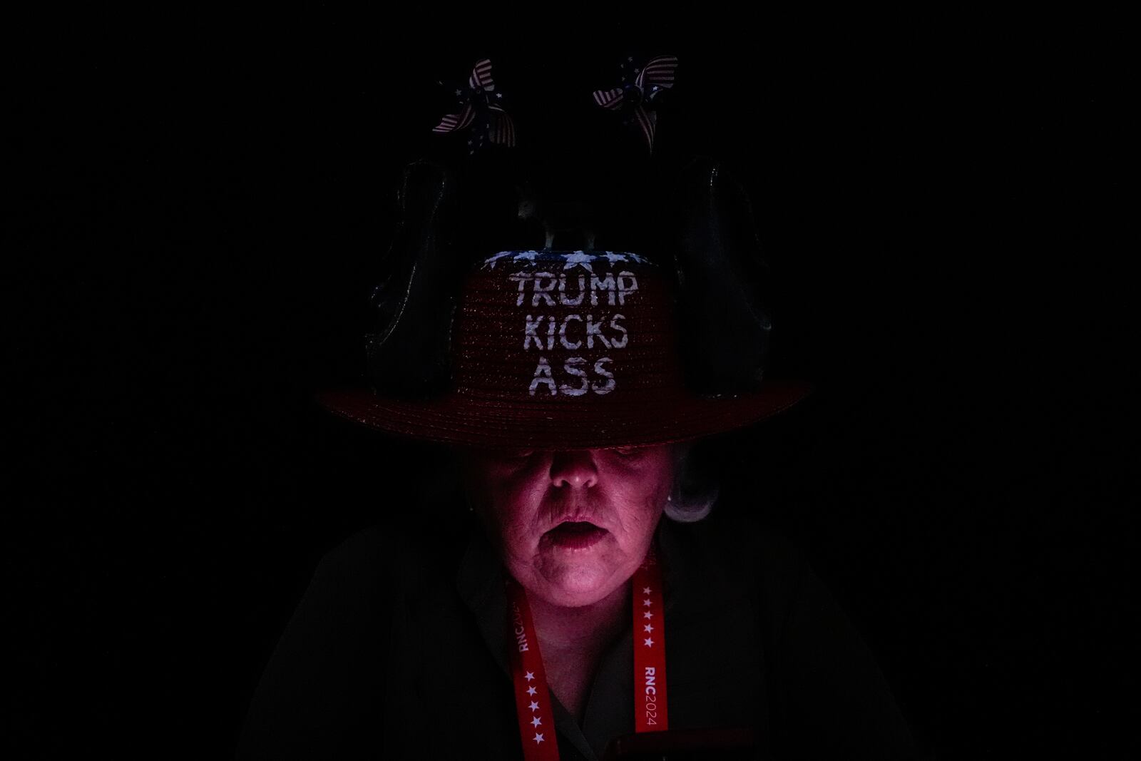 A delegate looks at her phone during the Republican National Convention Wednesday, July 17, 2024, in Milwaukee. (AP Photo/Julia Demaree Nikhinson)