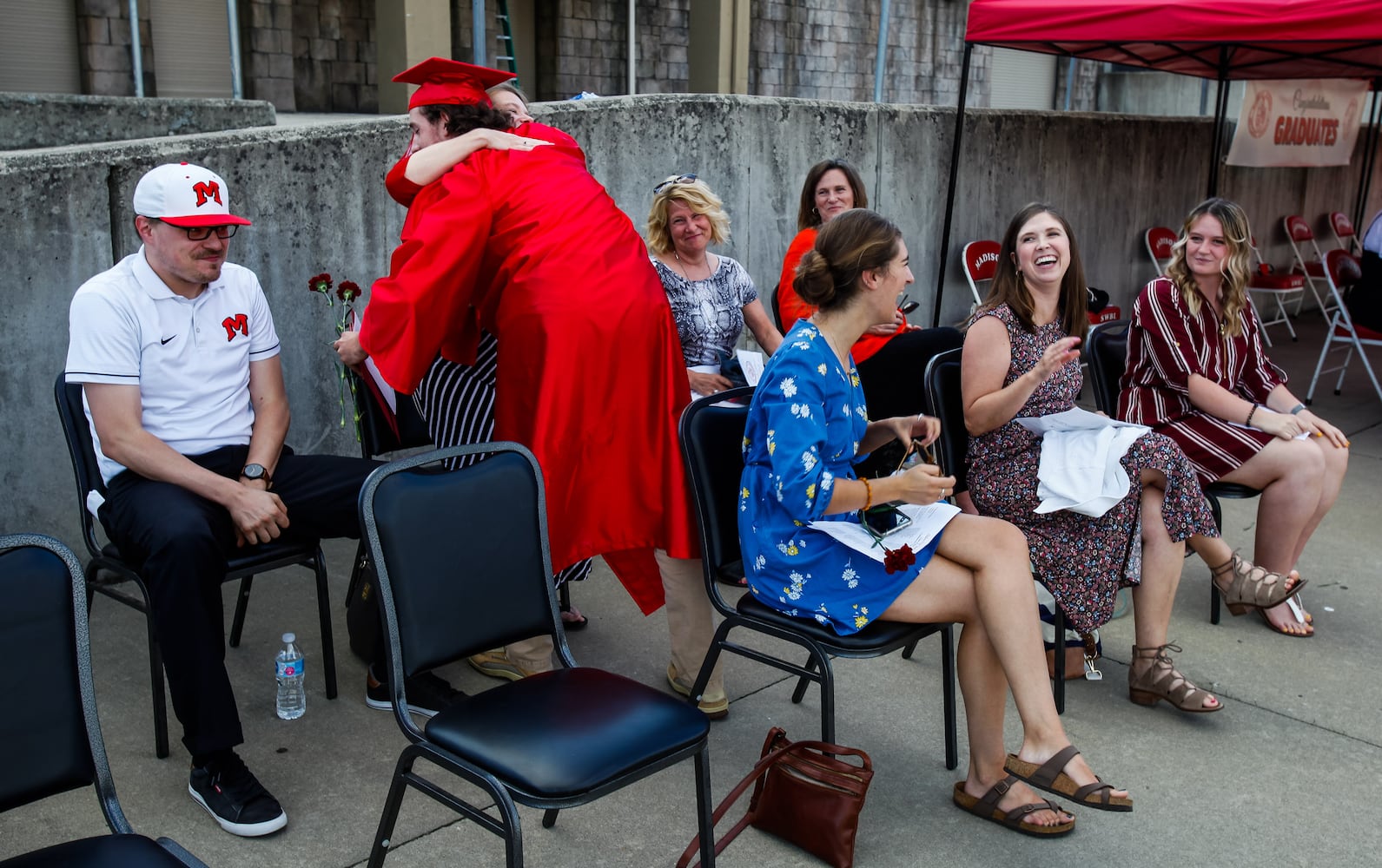 Madison High School drive-thru graduation ceremony at Land of Illusion