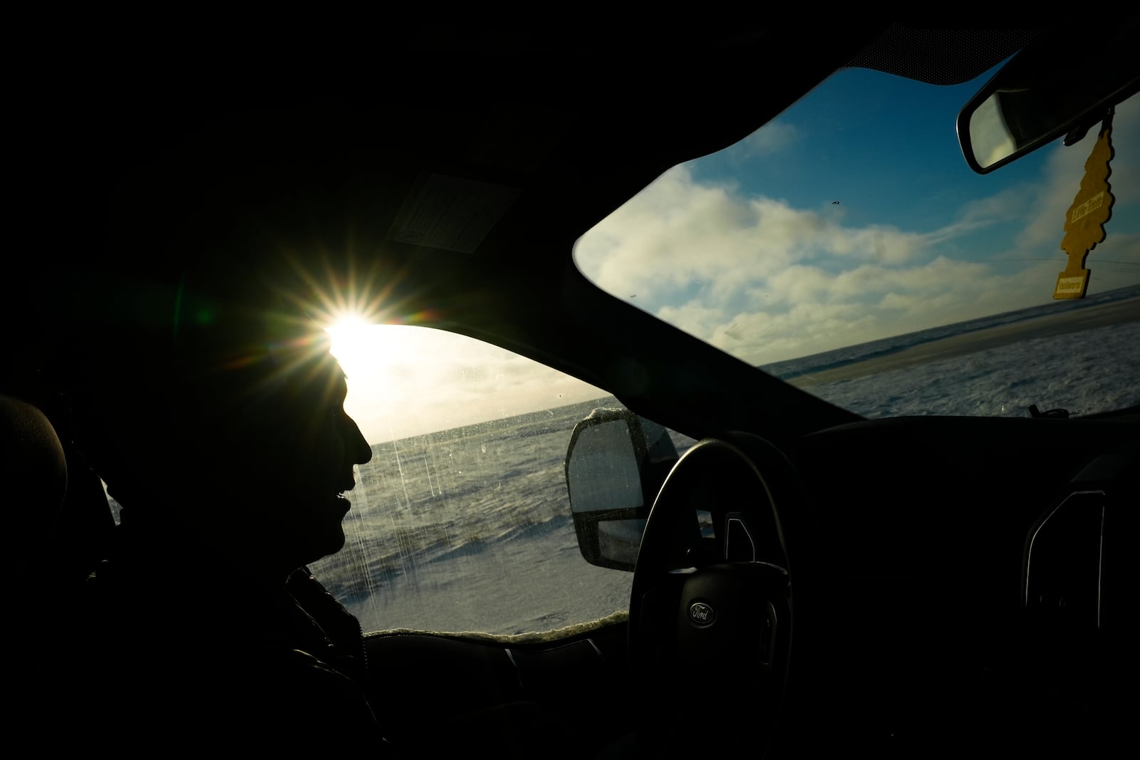 Kaktovik Mayor Nathan Gordon Jr. drives past open tundra on the west side of Barter Island while keeping an eye out for polar bears near Kaktovik, Alaska, Monday, Oct. 14, 2024. (AP Photo/Lindsey Wasson)