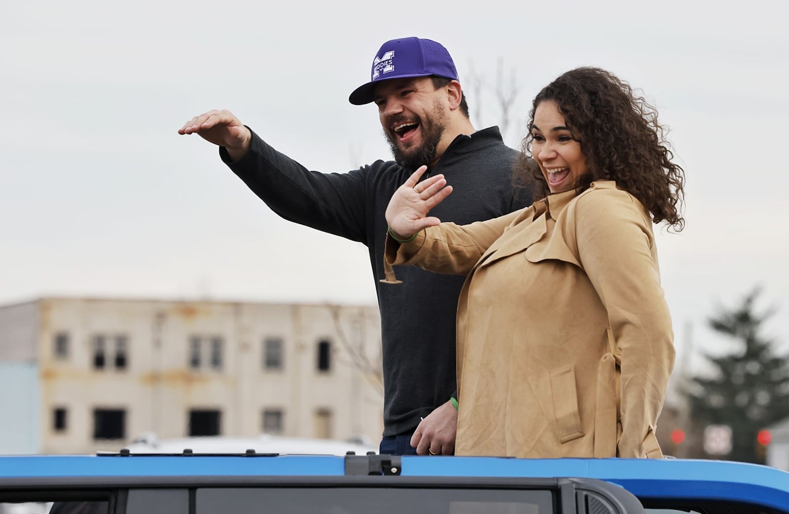 Kyle Schwarber and wife, Paige, wave at the crowd during the Middletown Santa Parade Saturday, Nov. 26, 2022 in downtown Middletown. Middletown native Kyle Schwarber served as grand marshal. NICK GRAHAM/STAFF