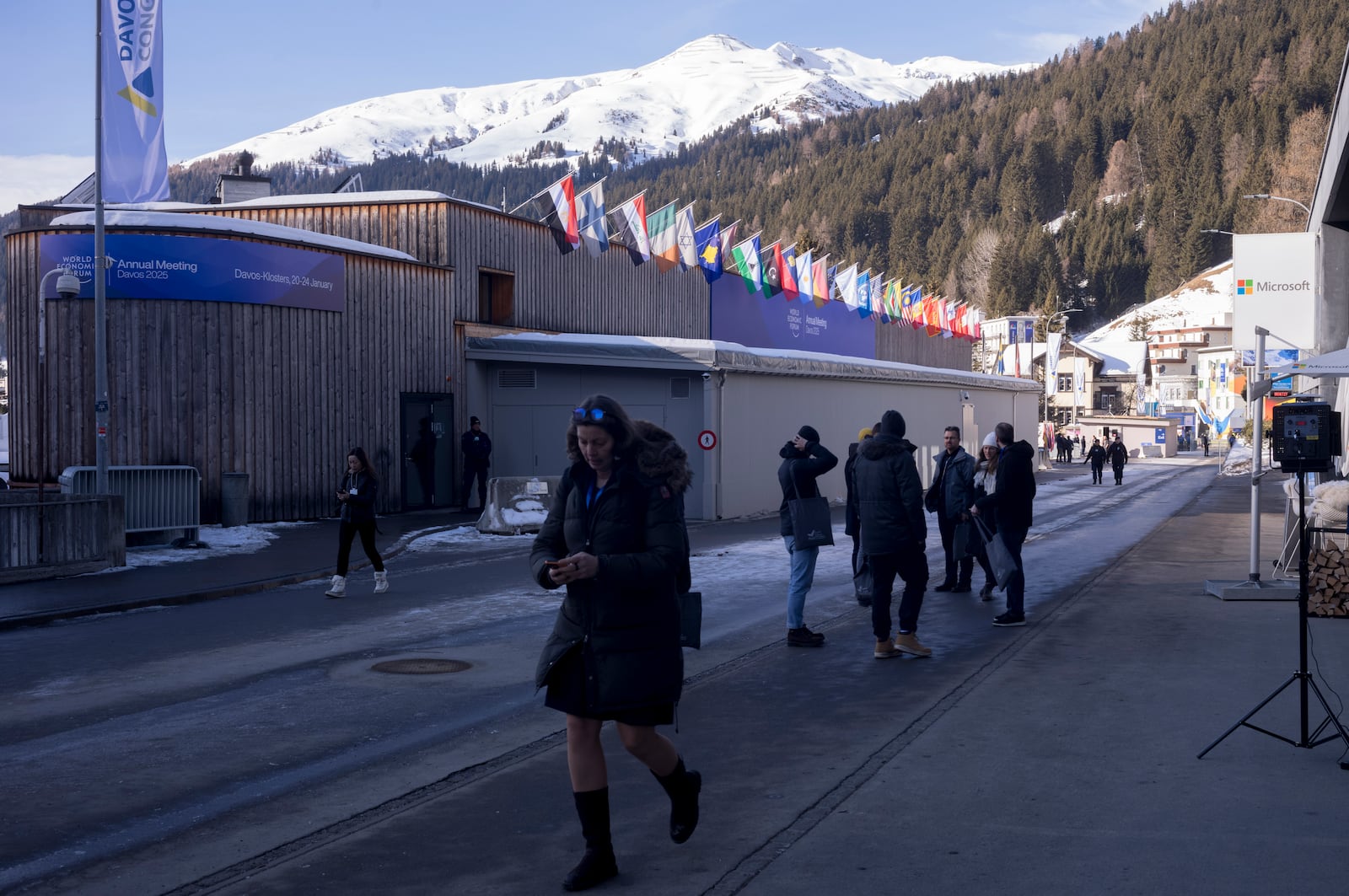 People leave the Congress Center on the final day at the World Economic Forum in Davos, Switzerland, Friday, Jan. 24, 2025. (AP Photo/Markus Schreiber)