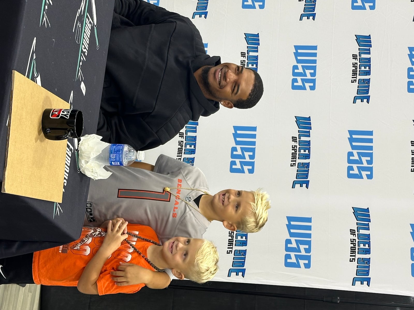 Cincinnati wide receiver Ja’Marr Chase signed autographs on Saturday, Aug. 31, 2024, at Cincinnati's Premier Sports Cards and Autograph Show held at Spooky Nook Sports Champion Mill in Hamilton. The show was relocated to the Butler County city as the Duke Energy Convention Center is undergoing renovations. Current and past professional athletes were on hand at the two-day event this past weekend to sign autographs, which also featured sports card and memorabilia vendors. Pictured is chase posing with two young fans during Saturday's autograph session. PROVIDED