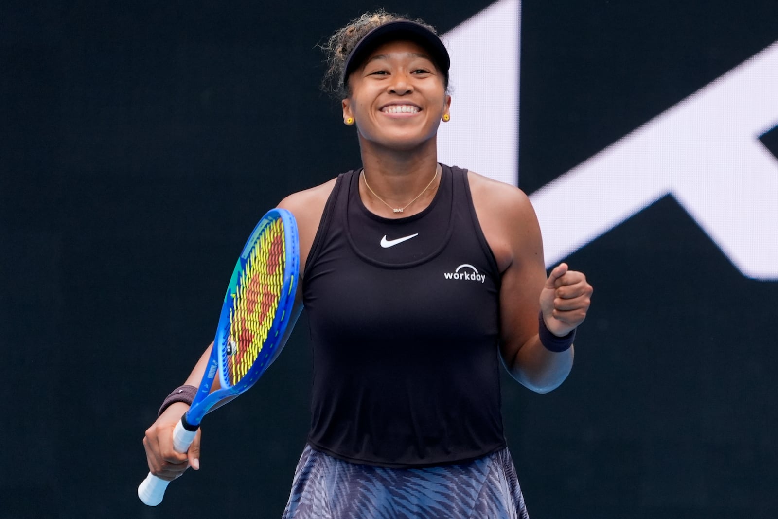 Naomi Osaka of Japan celebrates after defeating Karolina Muchova of the Czech Republic in their second round match at the Australian Open tennis championship in Melbourne, Australia, Wednesday, Jan. 15, 2025. (AP Photo/Asanka Brendon Ratnayake)