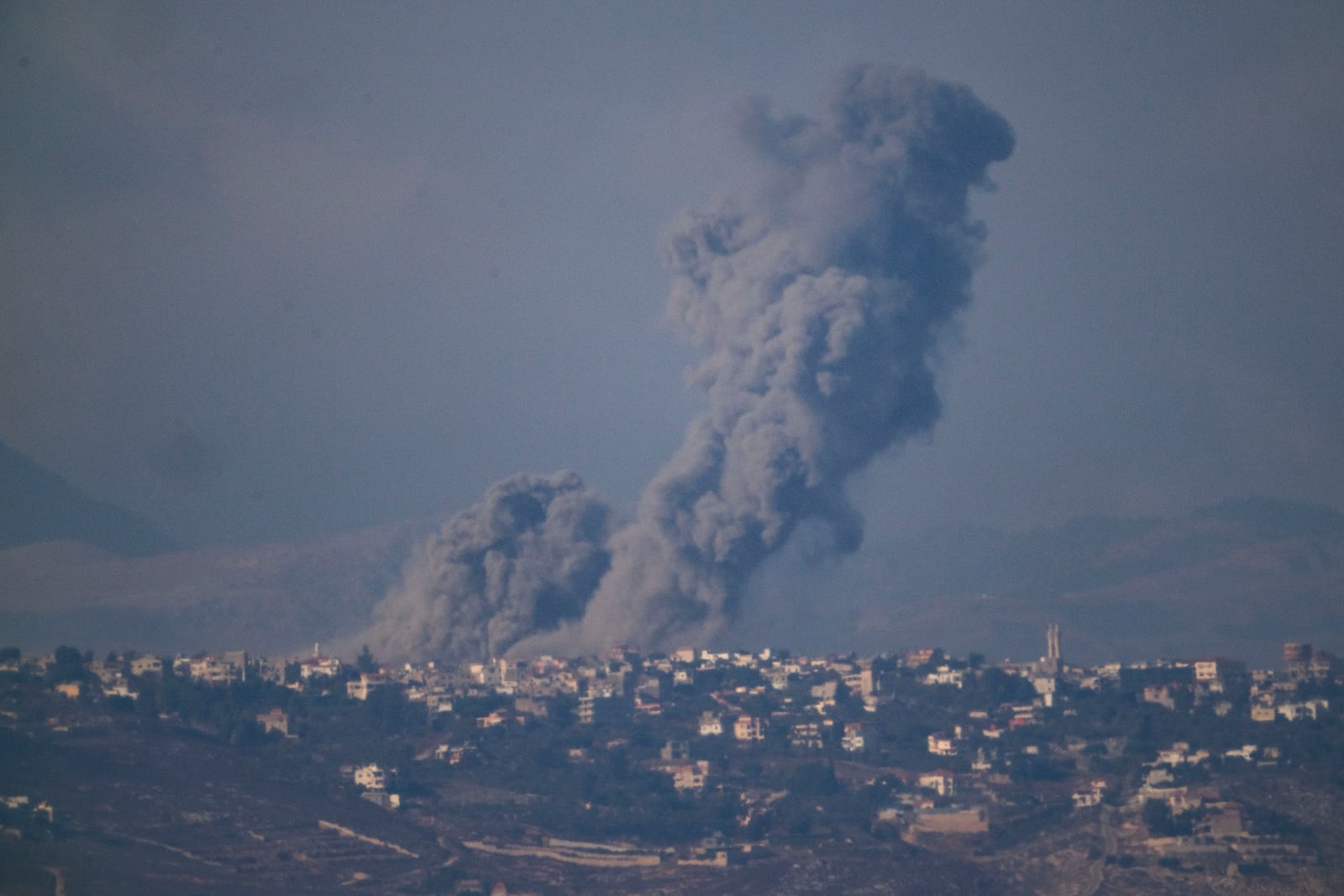 Smoke rises following Israeli bombardment in southern Lebanon as seen from northern Israel, Thursday, Oct. 17, 2024. (AP Photo/Leo Correa)