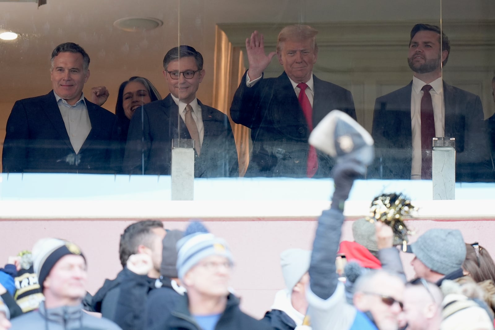 Senator-elect Dave McCormick, R-Pa., from left, President-elect Donald Trump's nominee to be Director of National Intelligence Tusli Gabbard, House Speaker Mike Johnson, Trump and Vice President-elect JD Vance attend the NCAA college football game between Army and Navy at Northwest Stadium in Landover, Md., Saturday, Dec. 14, 2024. (AP Photo/Stephanie Scarbrough)