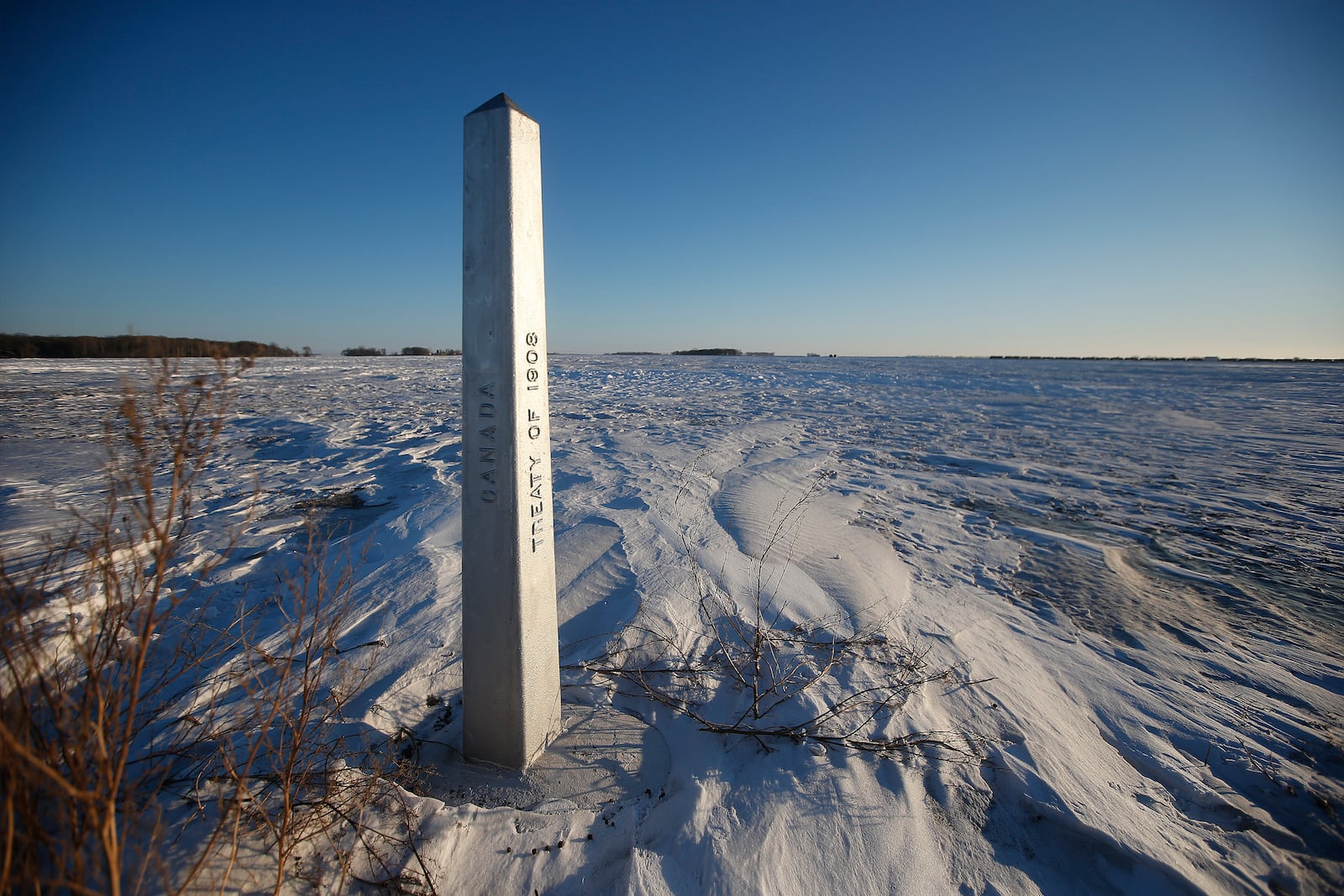 FILE - A border marker, between the United States and Canada is shown just outside of Emerson, Manitoba, on Thursday, Jan. 20, 2022. (John Woods/The Canadian Press via AP, File)