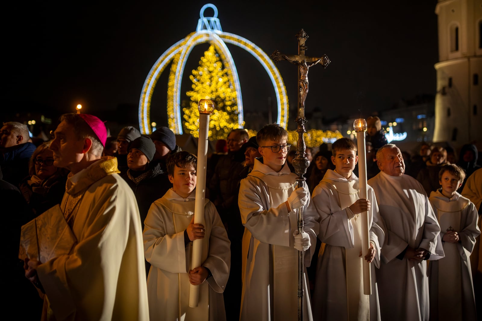 Priests and clergy attend the Christmas celebration midnight Mass at the Cathedral-Basilica in Vilnius, Lithuania, Tuesday, Dec. 24, 2024. (AP Photo/Mindaugas Kulbis)