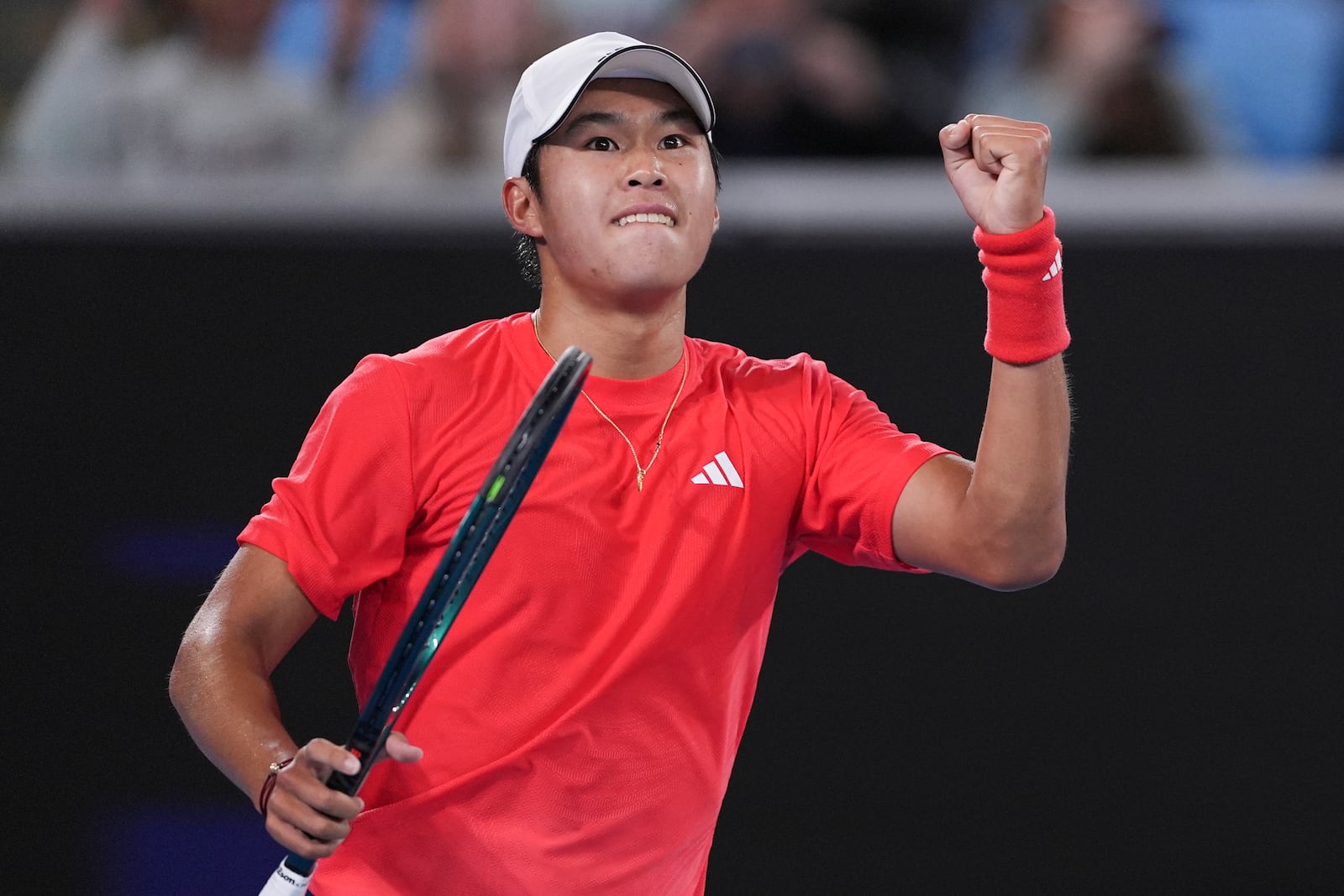 Learner Tien of the U.S. gestures during his second round match against Daniil Medvedev of Russia at the Australian Open tennis championship in Melbourne, Australia, Thursday, Jan. 16, 2025. (AP Photo/Ng Han Guan)