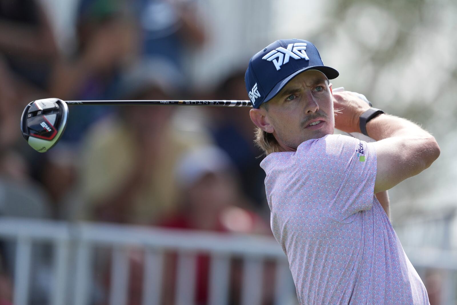 Jake Knapp, of the United States, watches his shot on the first tee during the first round of the Mexico Open golf tournament in Puerto Vallarta, Mexico, Thursday, Feb. 20, 2025. (AP Photo/Fernando Llano)