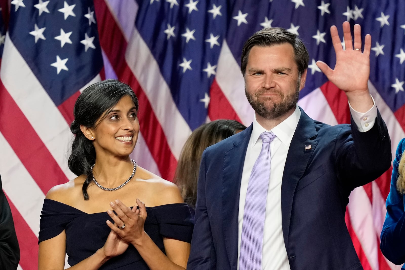 Republican vice presidential nominee Sen. JD Vance, R-Ohio, waves as his wife Usha Vance looks on at an election night watch party, Wednesday, Nov. 6, 2024, in West Palm Beach, Fla. (AP Photo/Alex Brandon)